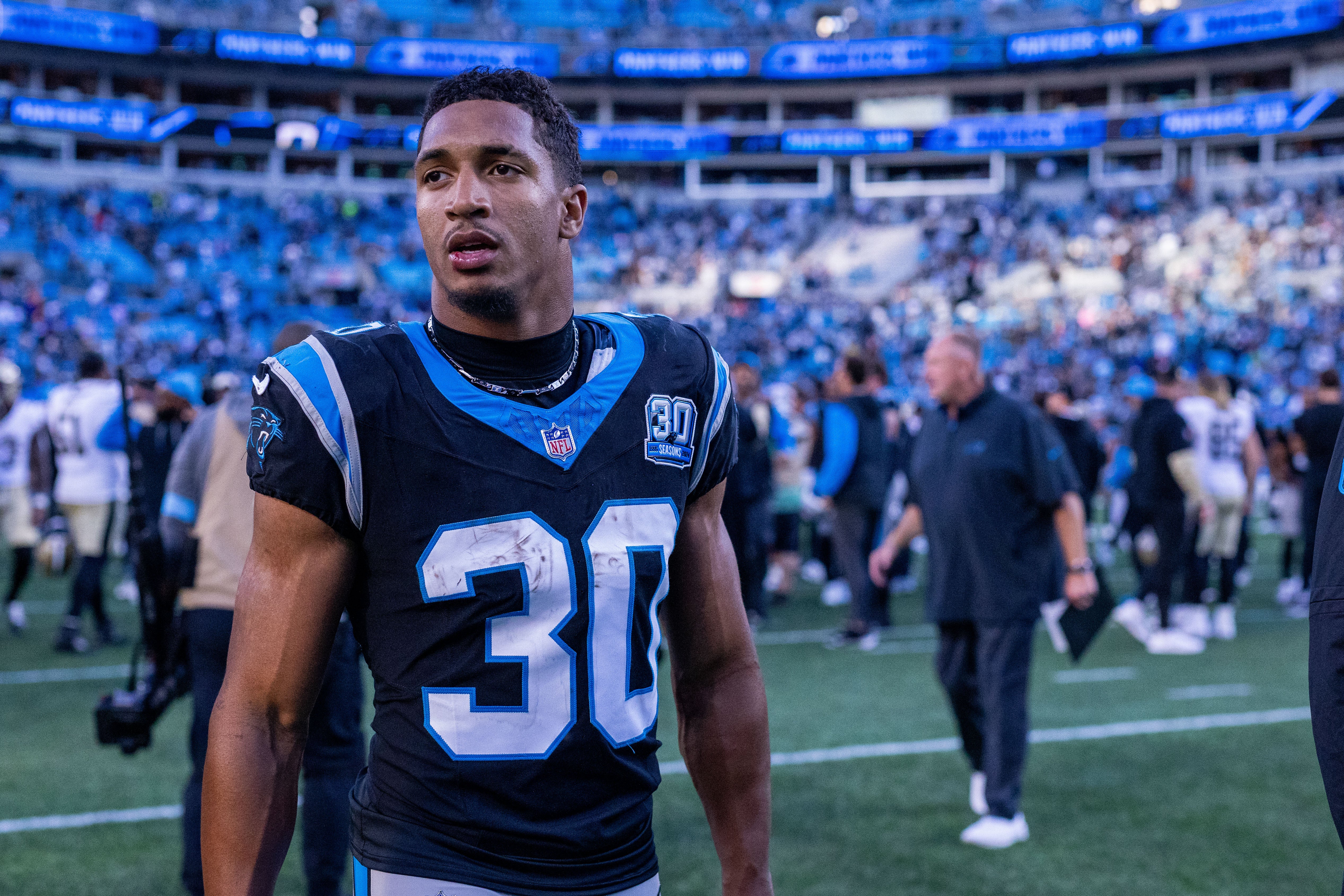 Nov 3, 2024; Charlotte, North Carolina, USA; Carolina Panthers running back Chuba Hubbard (30) walks off after defeating the New Orleans Saints at Bank of America Stadium.
