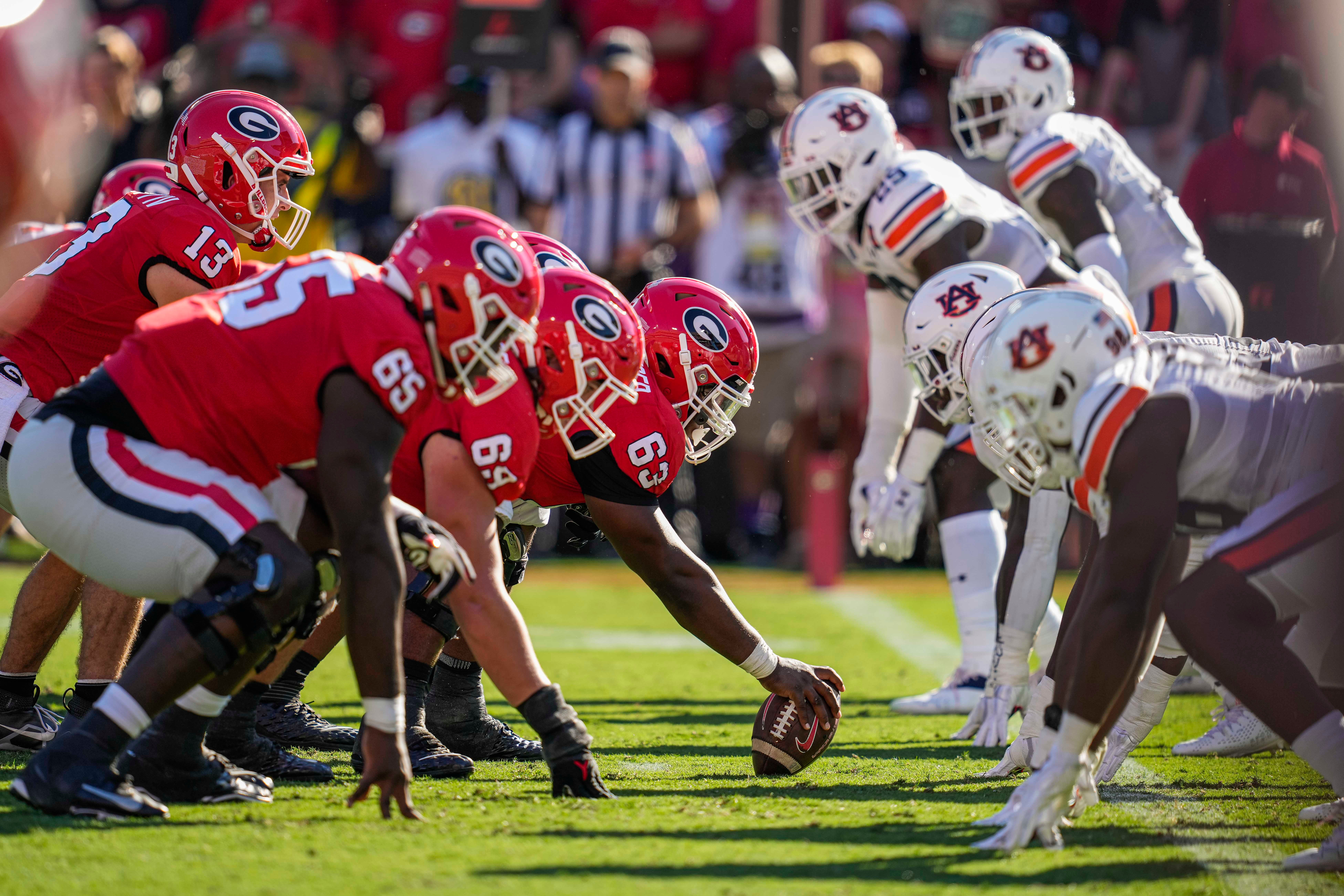 The Georgia Bulldogs offense lines up against the Auburn Tigers defense on the one yard line during the first half at Sanford Stadium.