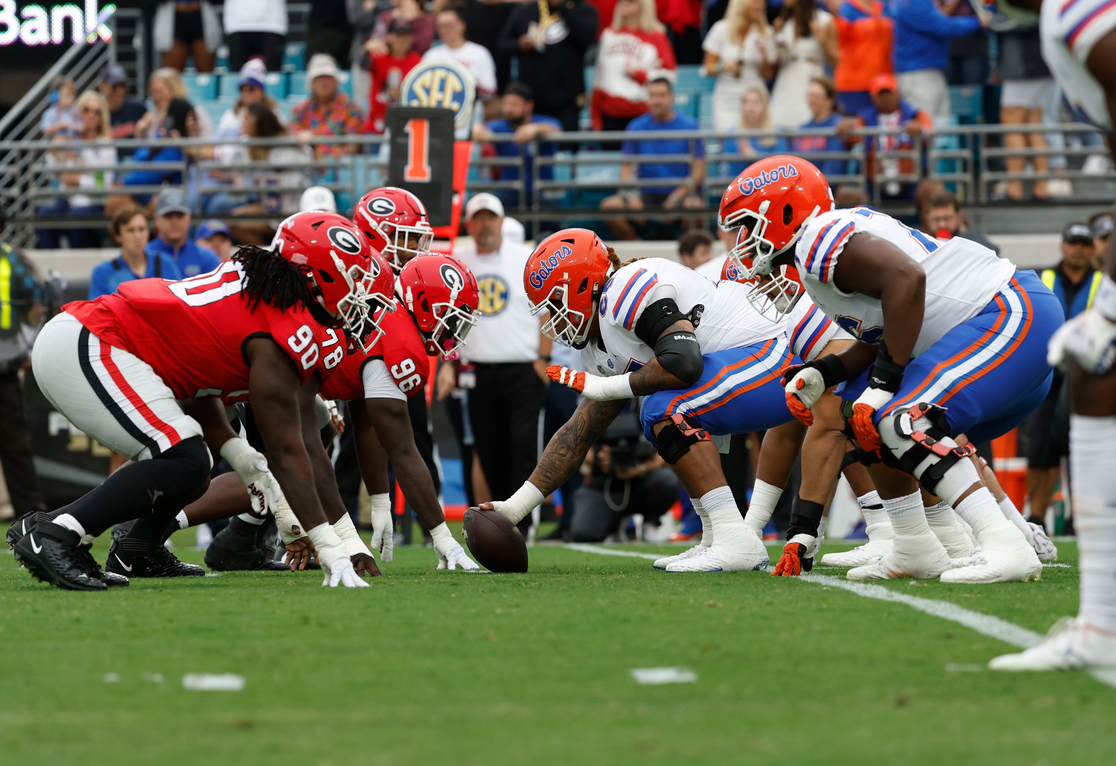 Florida Gators offensive lineman Kingsley Eguakun (65) and offensive line line up on the of scrimmage with Georgia Bulldogs defensive lineman Zion Logue (96) and defensive line during the first quarterback.