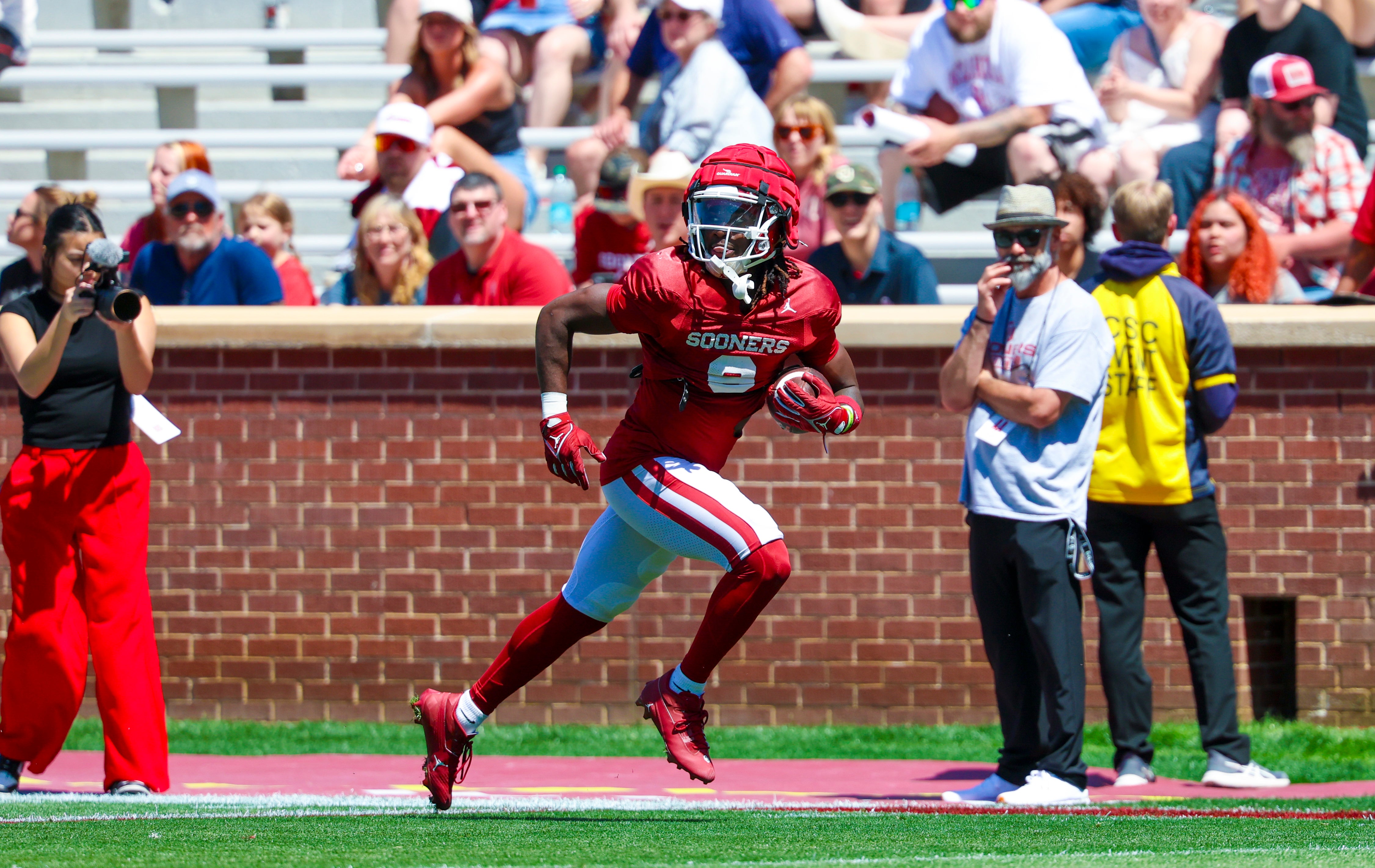 Apr 12, 2025; Norman, OK, USA; Oklahoma Sooners running back Tory Blaylock (6) makes a touchdown catch during the Crimson Combine at Gaylord Family-Oklahoma Memorial Stadium.