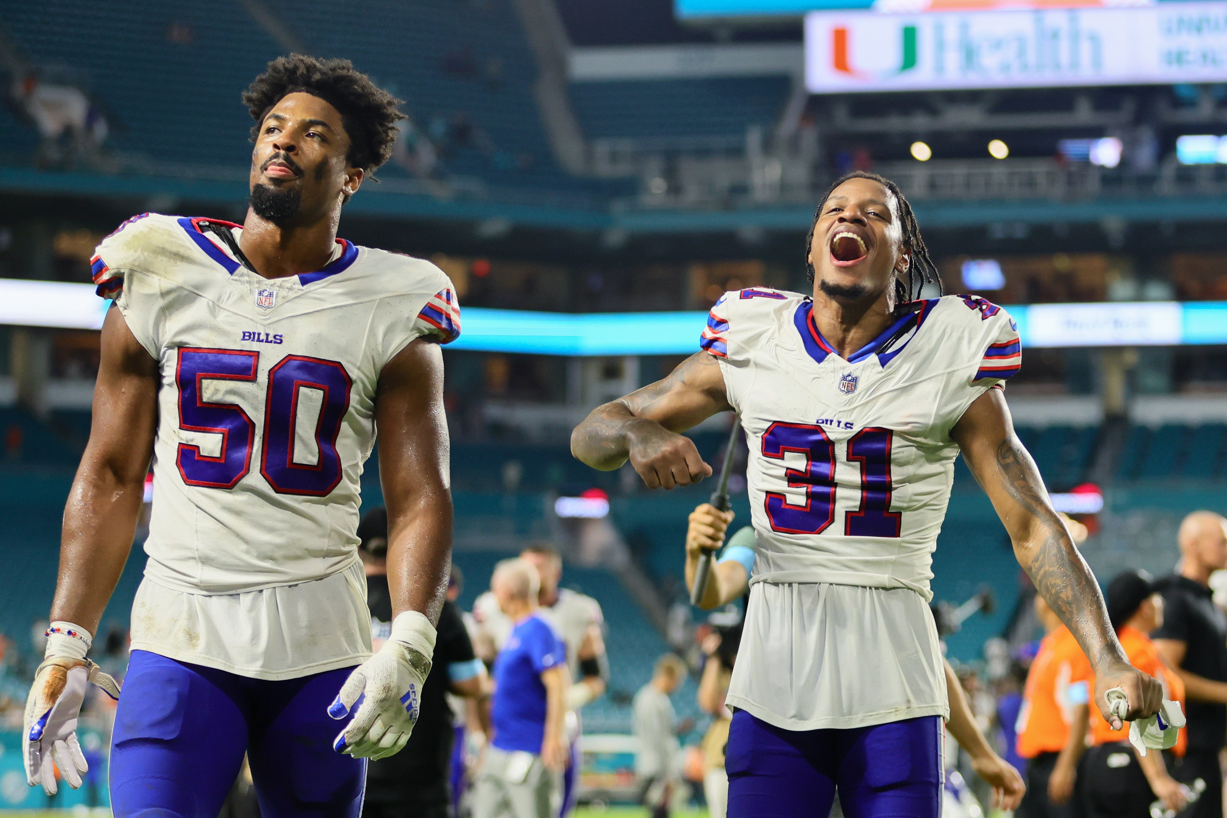 Sep 12, 2024; Miami Gardens, Florida, USA; Buffalo Bills cornerback Rasul Douglas (31) and defensive end Greg Rousseau (50) walk off the field after the game against the Miami Dolphins at Hard Rock Stadium.