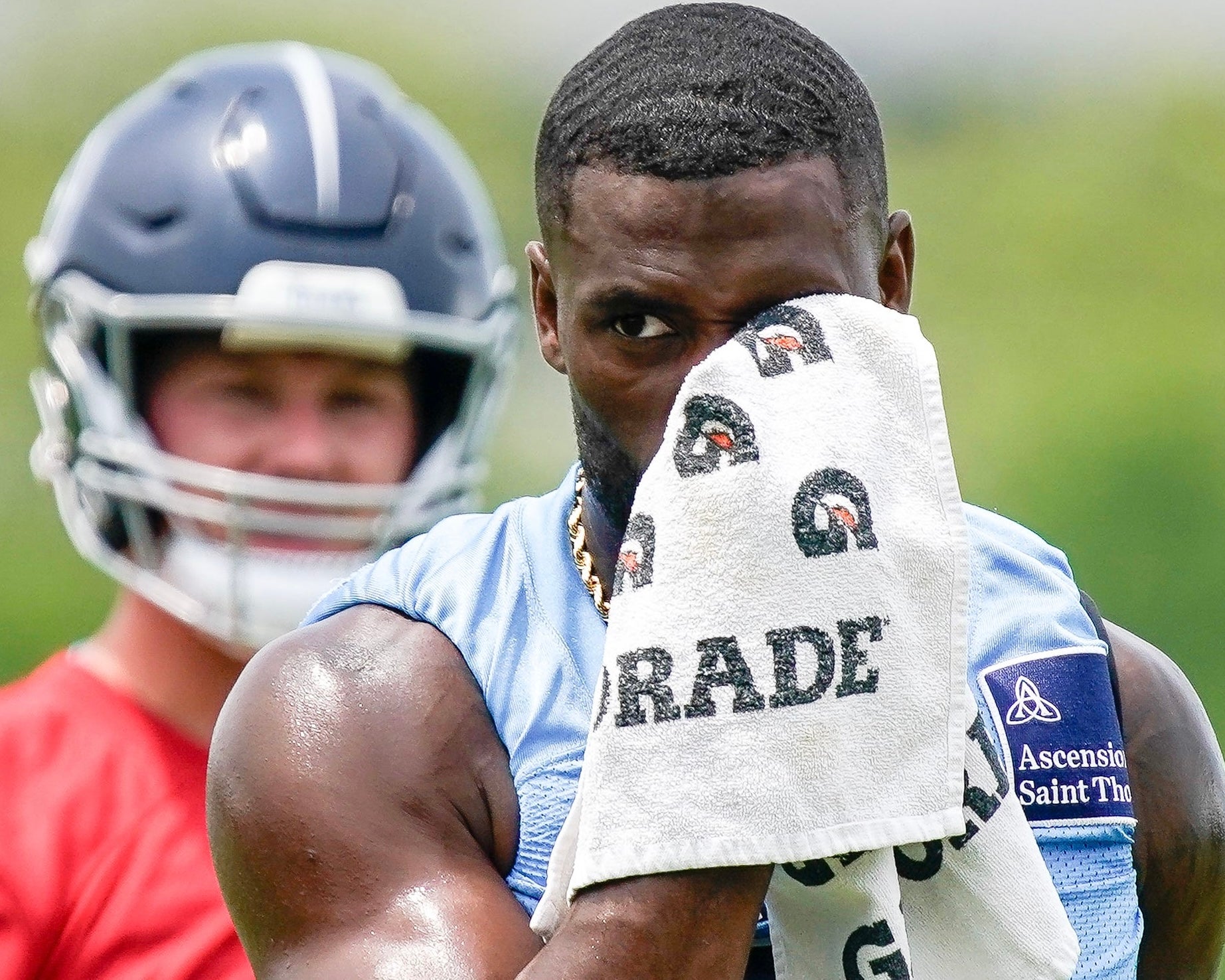 Tennessee Titans wide receiver Van Jefferson (11) wipes away sweat during minicamp practice at Ascension Saint Thomas Sports Park in Nashville, Tenn., Wednesday, June 11, 2025.
