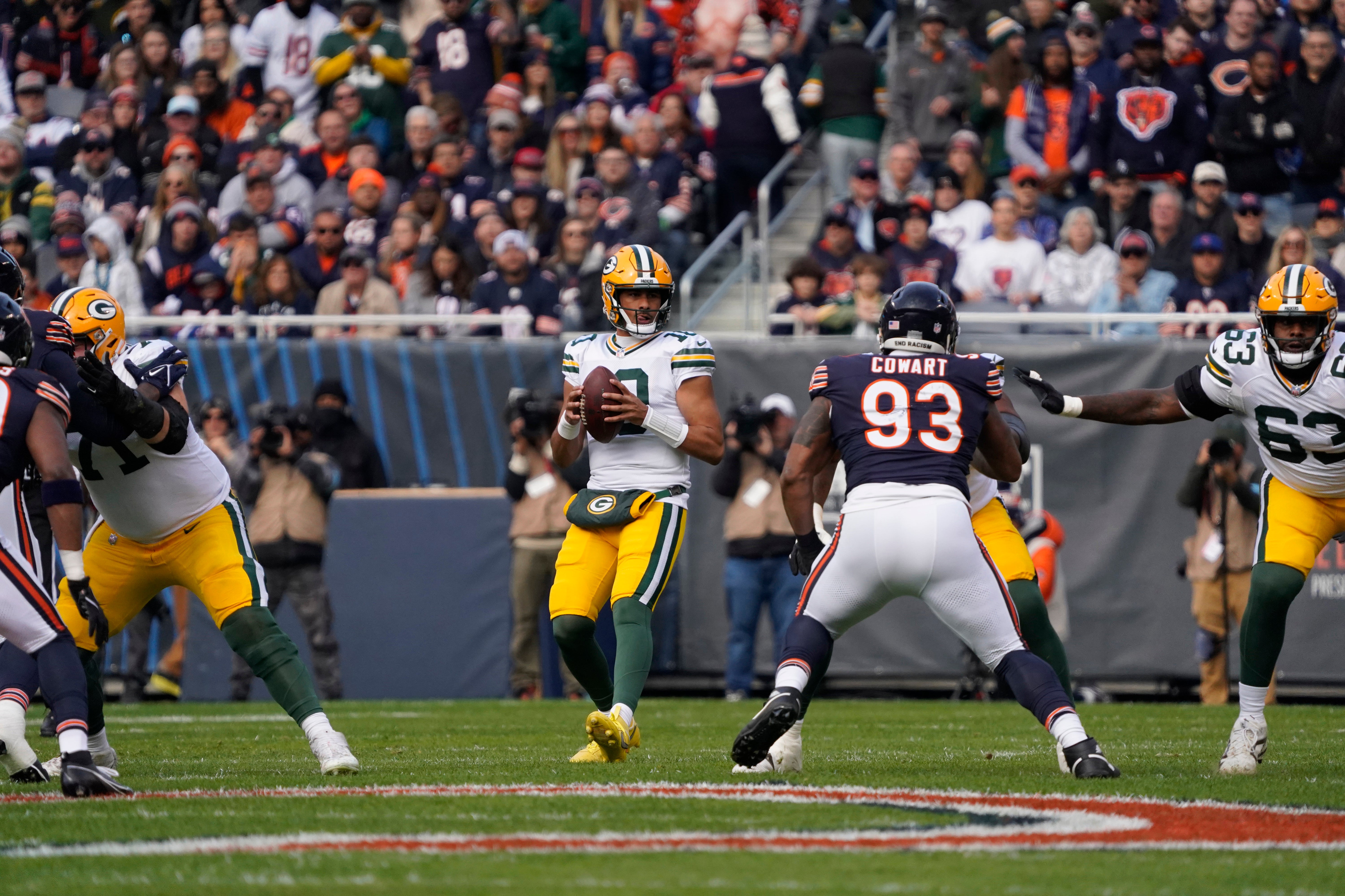 Green Bay Packers quarterback Jordan Love (10) looks to pass against the Chicago Bears during the first half at Soldier Field.