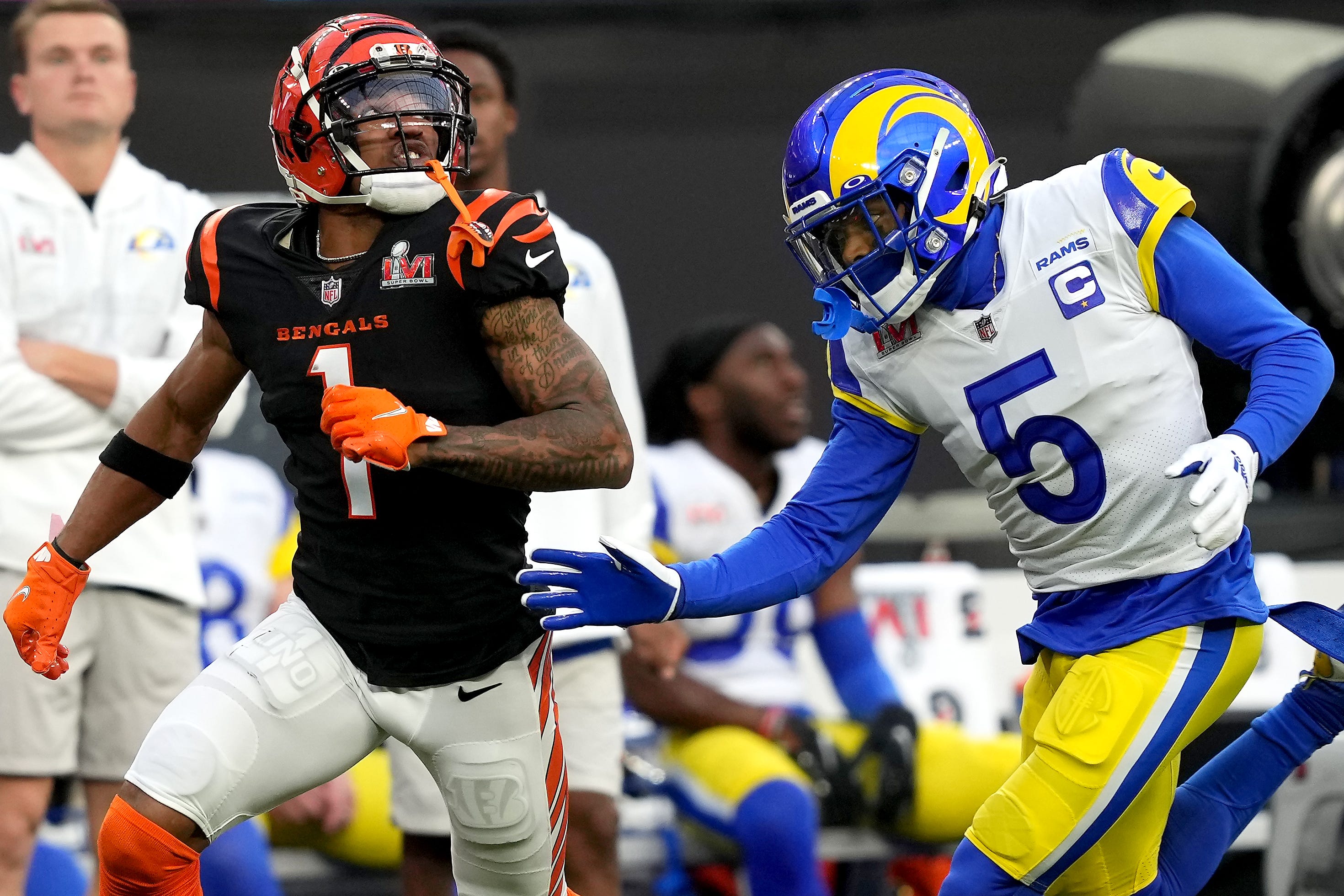 Cincinnati Bengals wide receiver Ja'Marr Chase (1) tracks a deep pass as Los Angeles Rams cornerback Jalen Ramsey (5) defends in the first quarter during Super Bowl 56, Sunday, Feb. 13, 2022, at SoFi Stadium in Inglewood, Calif.  
