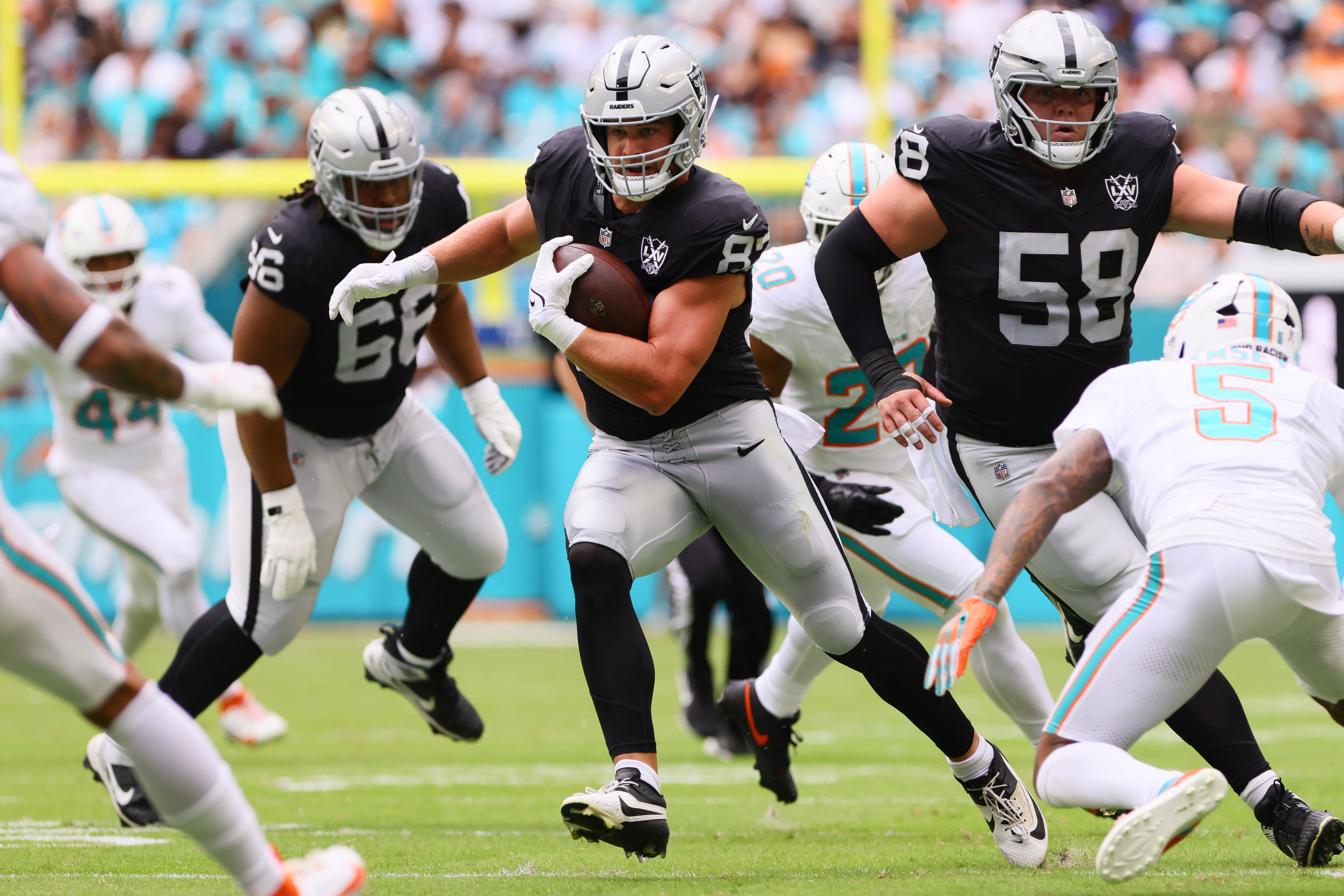 Las Vegas Raiders tight end Michael Mayer (87) runs with the football against the Miami Dolphins during the first quarter at Hard Rock Stadium.