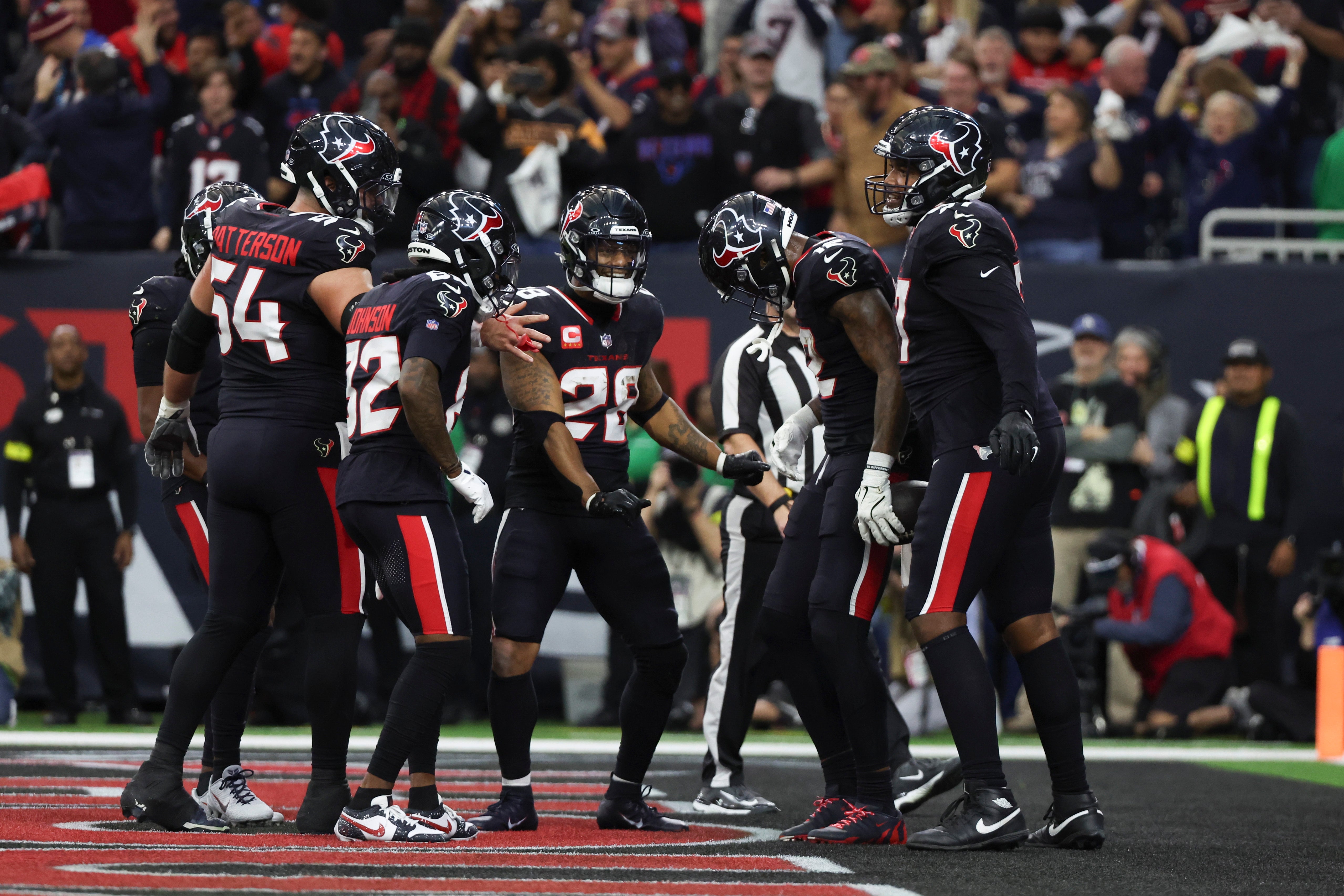 Houston Texans wide receiver Nico Collins (12) celebrates a touchdown against the Los Angeles Chargers in the second quarter in an AFC wild card game at NRG Stadium.