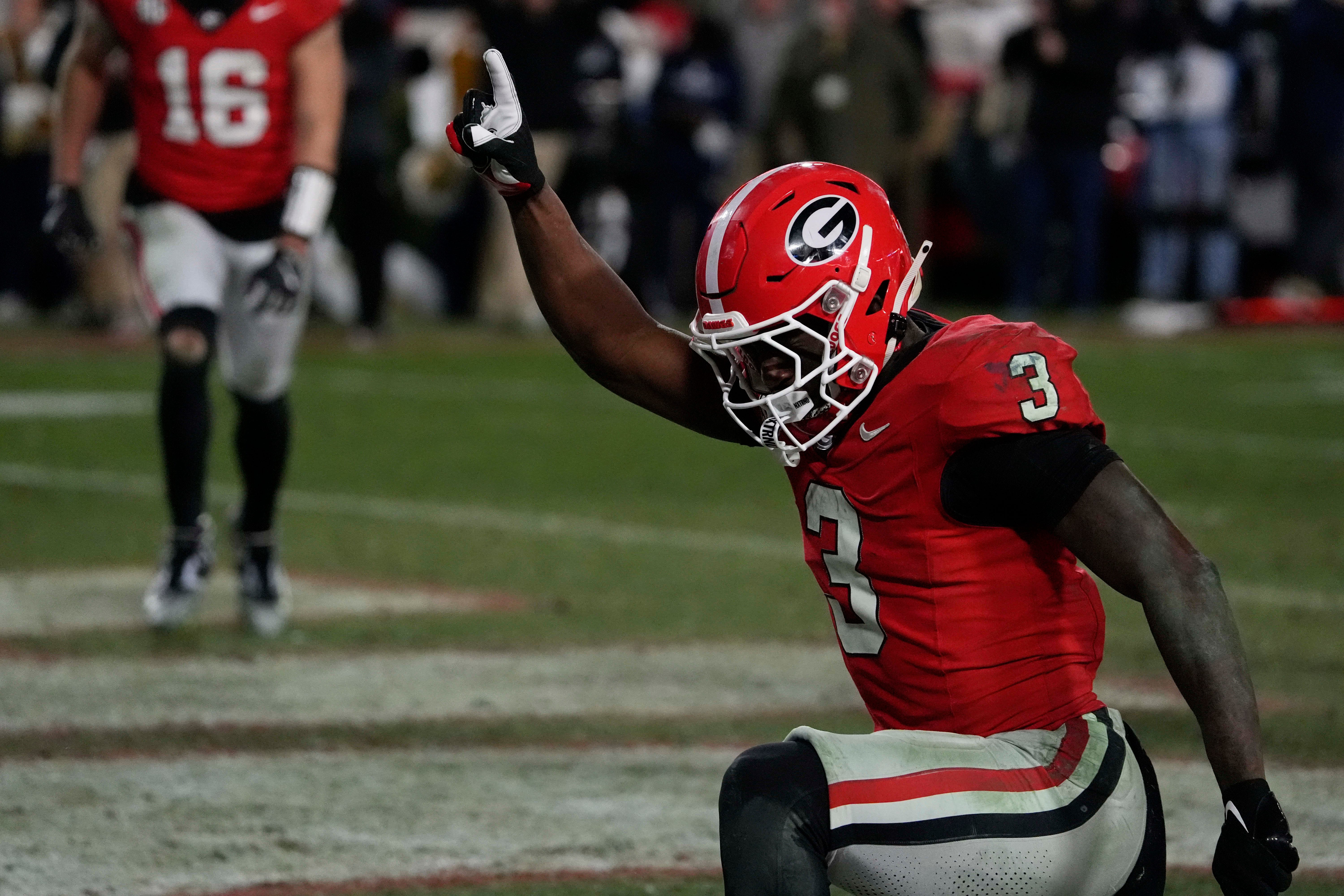 Georgia running back Nate Frazier (3) celebrates after driving in for the game winning score during overtime of a NCAA college football game against Georgia Tech in Athens, Ga., on Friday, Nov. 29, 2024.