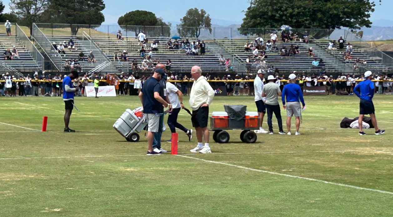 Tyler Smith agent Joe Panos speaks to Stephen Jones at Dallas Cowboys training camp.