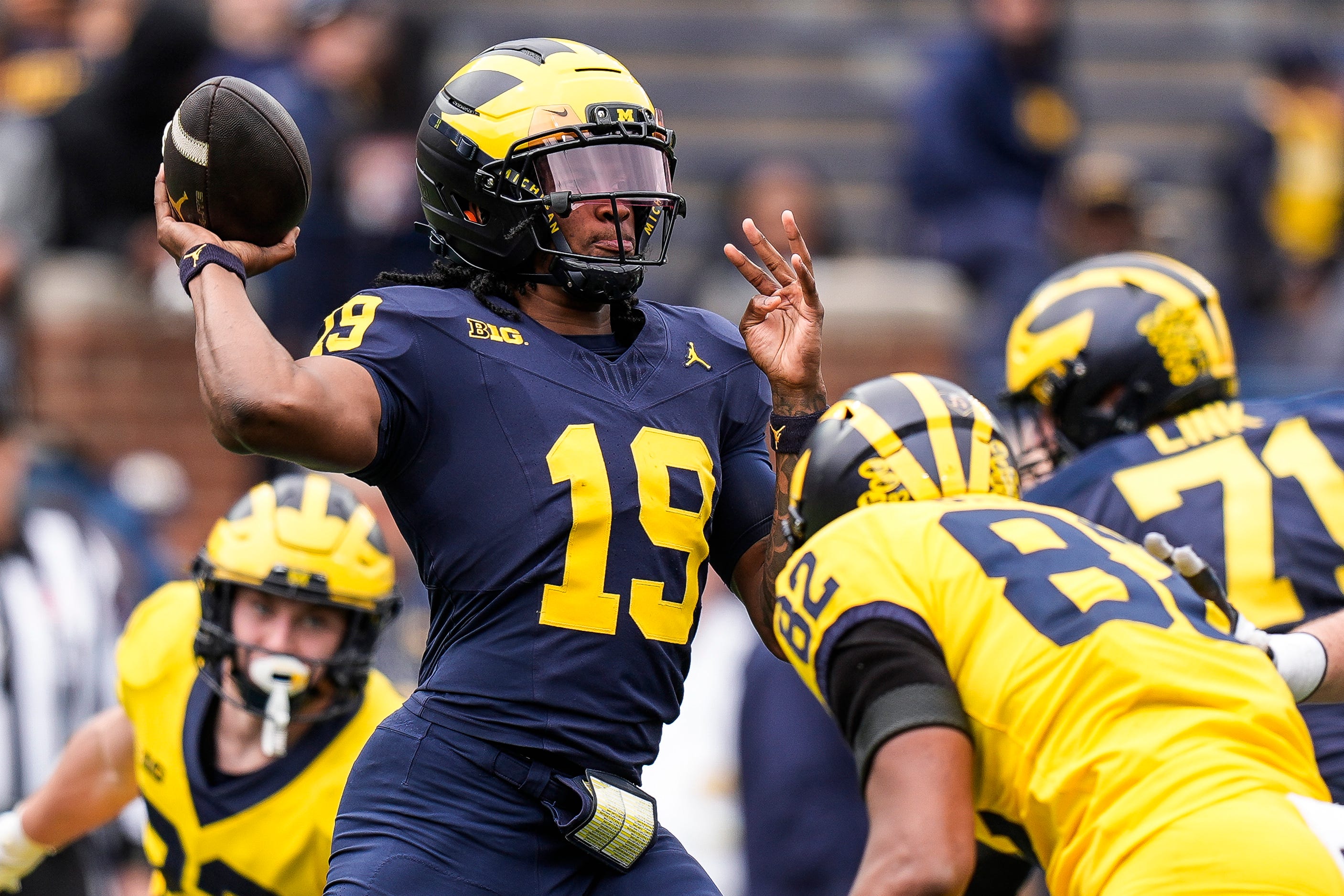 Team Blue quarterback Bryce Underwood (19) makes a pass against Team Maize during the second half of the spring game at Michigan Stadium in Ann Arbor on Saturday, April 19, 2025.