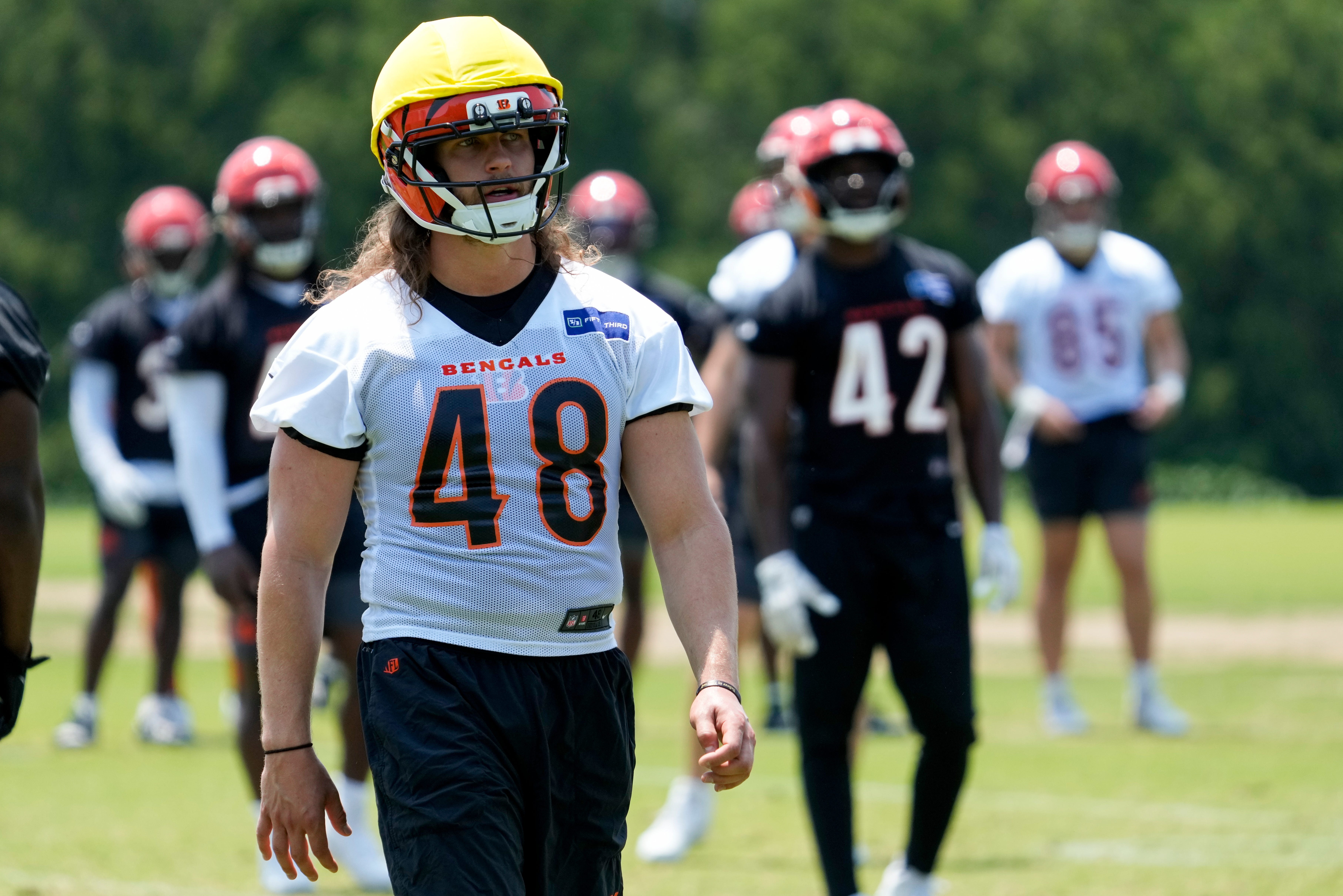 Cincinnati Bengals long snapper Cal Adomitis (48) walks between stations during a session of organized team activities on the Bengals practice field at Paycor Stadium in downtown Cincinnati on Tuesday, June 3, 2025.