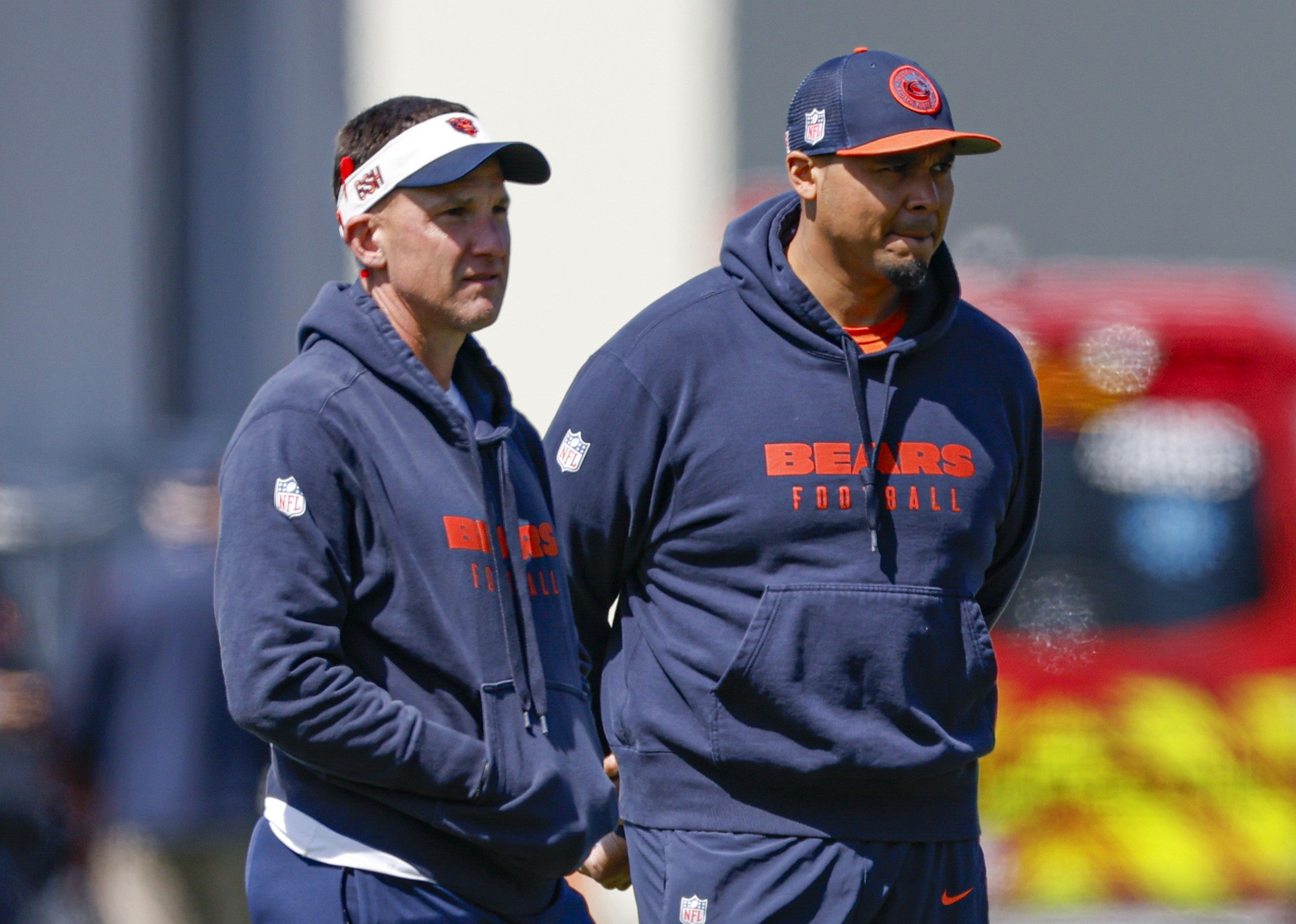 May 9, 2025; Lake Forest, IL, USA; Chicago Bears defensive coordinator Dennis Allen (L), general manager Ryan Poles (C) and head coach Ben Johnson (R) observe during the Rookie Minicamp at Halas Hall.