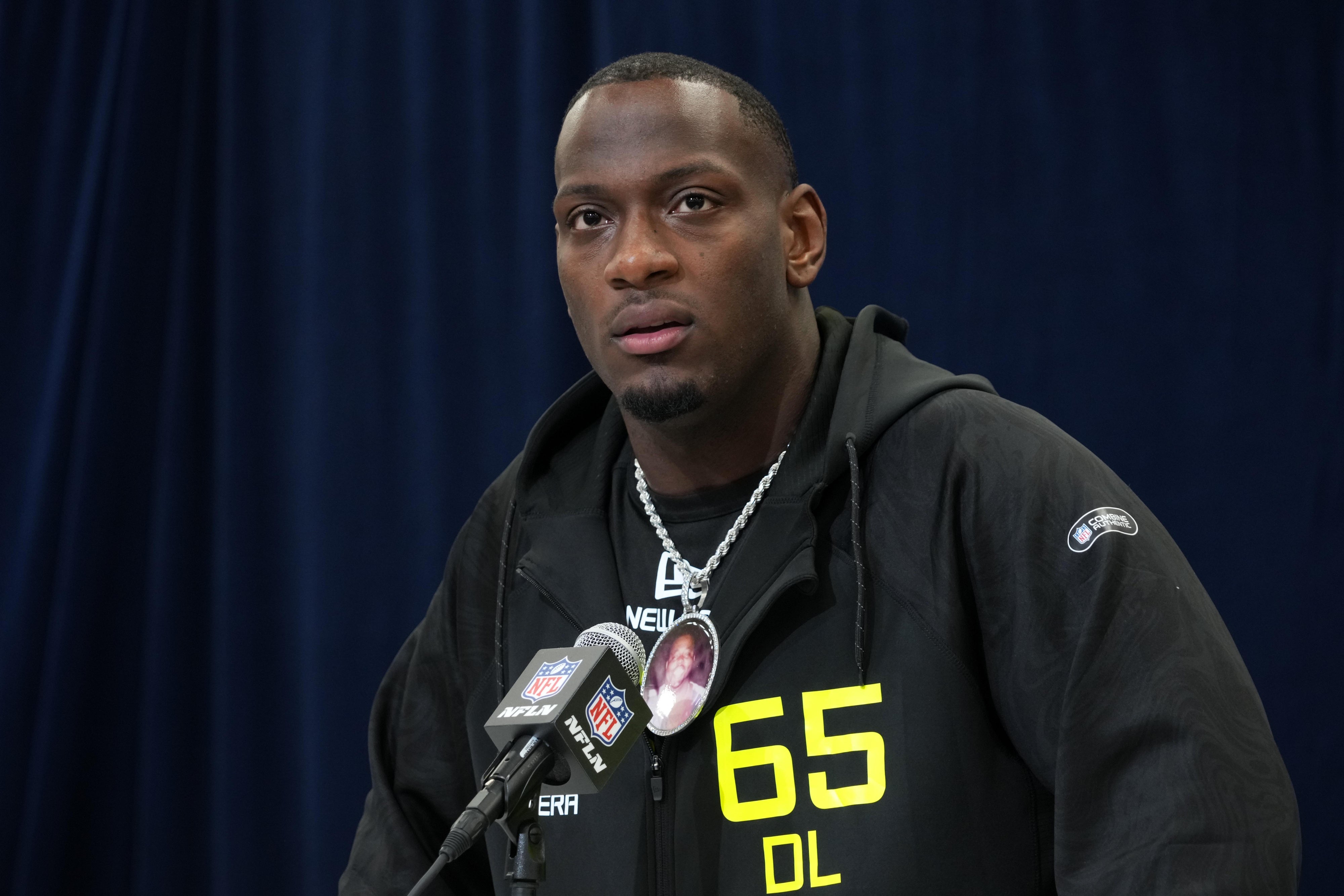 Texas A&M defensive lineman Nic Scourton (DL65) wears a medallion with picture of late uncle Harold during the 2025 NFL Scouting Combine at the Indiana Convention Center.