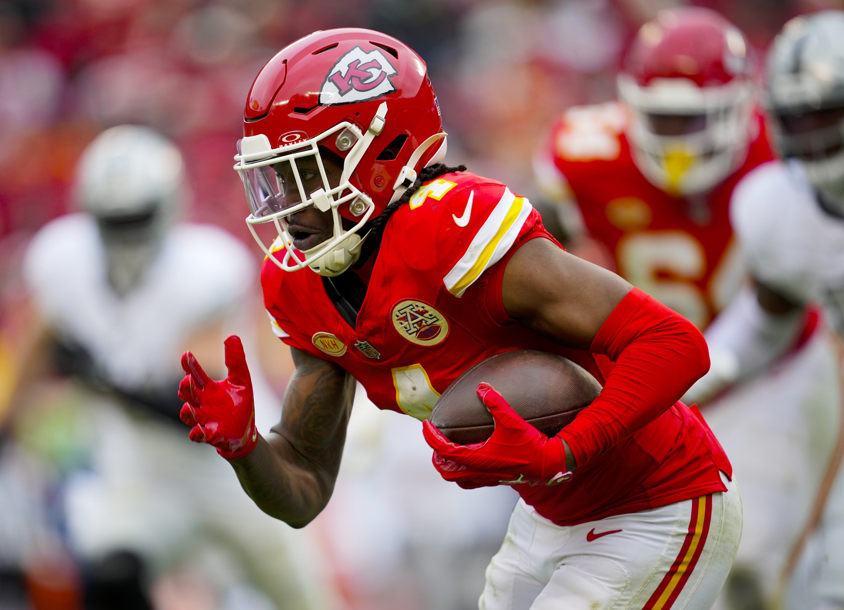 Dec 25, 2023; Kansas City, Missouri, USA; Kansas City Chiefs wide receiver Rashee Rice (4) runs with the ball against the Las Vegas Raiders during the first half at GEHA Field at Arrowhead Stadium.