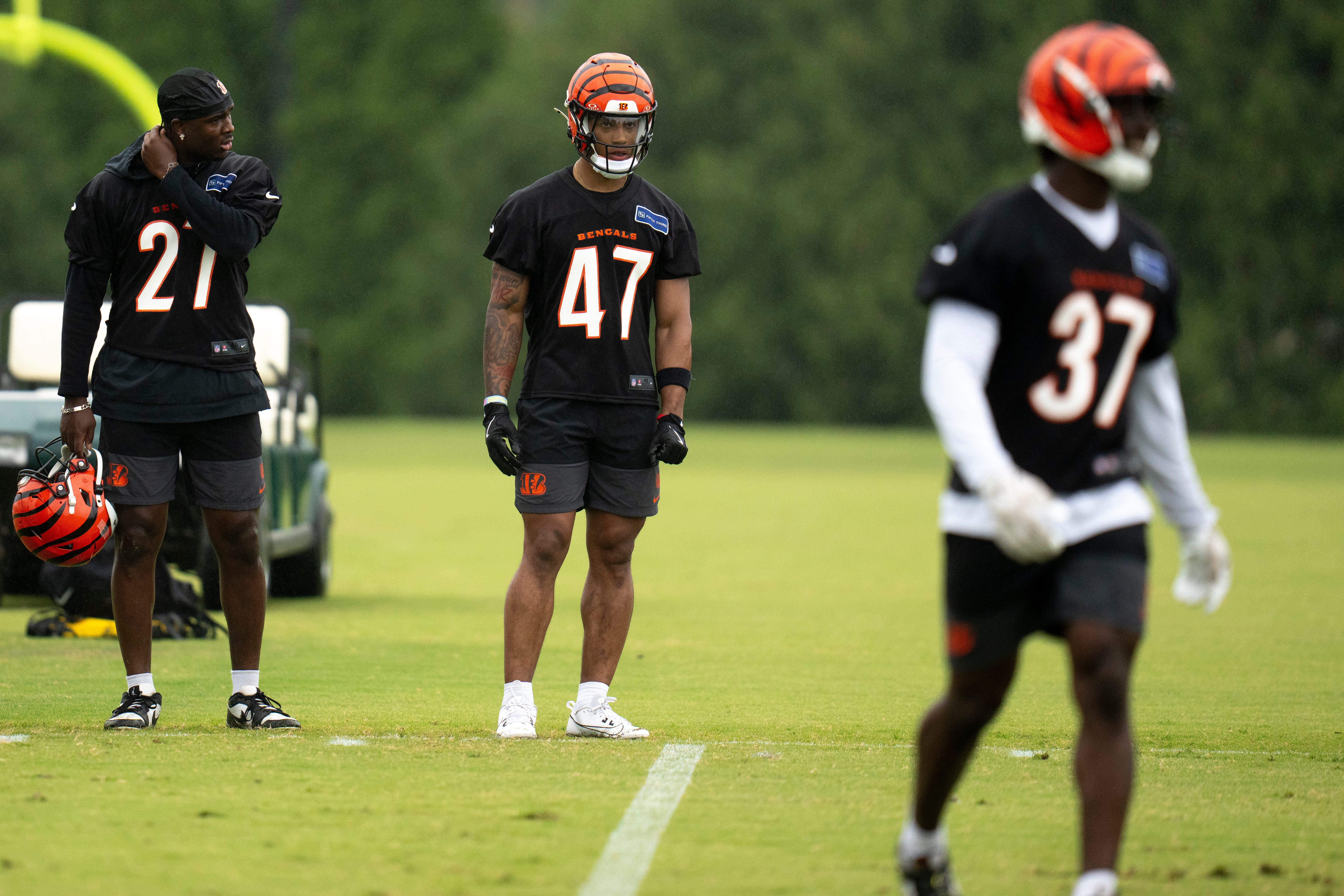 Cincinnati Bengals safety Jordan Battle (27) and Cincinnati Bengals safety Shaquan Loyal (47) look on during the Cincinnati Bengals practice in Cincinnati on Tuesday, May 27, 2025.