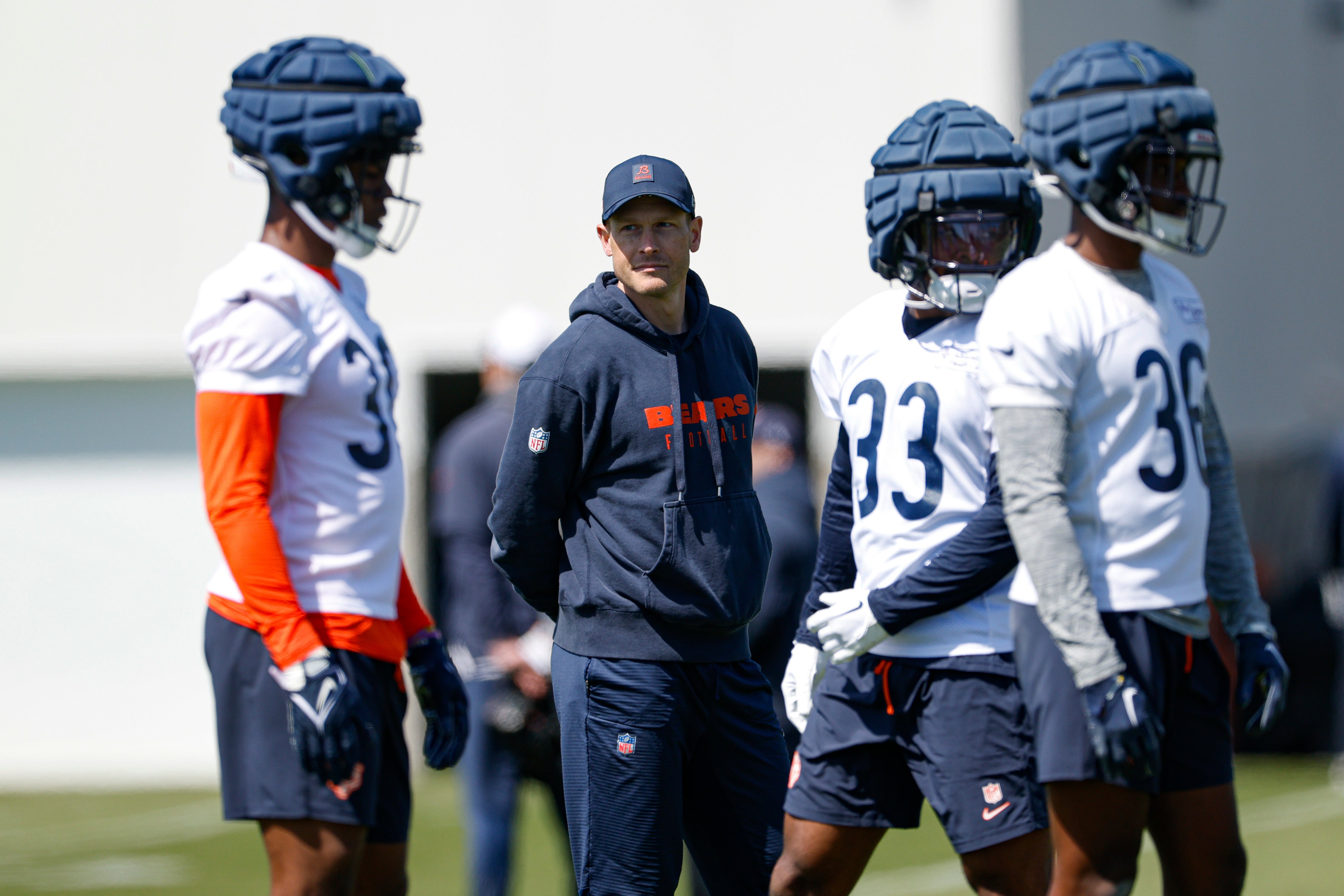 May 9, 2025; Lake Forest, IL, USA; Chicago Bears head coach Ben Johnson (second from left) looks on during the Rookie Minicamp at Halas Hall.