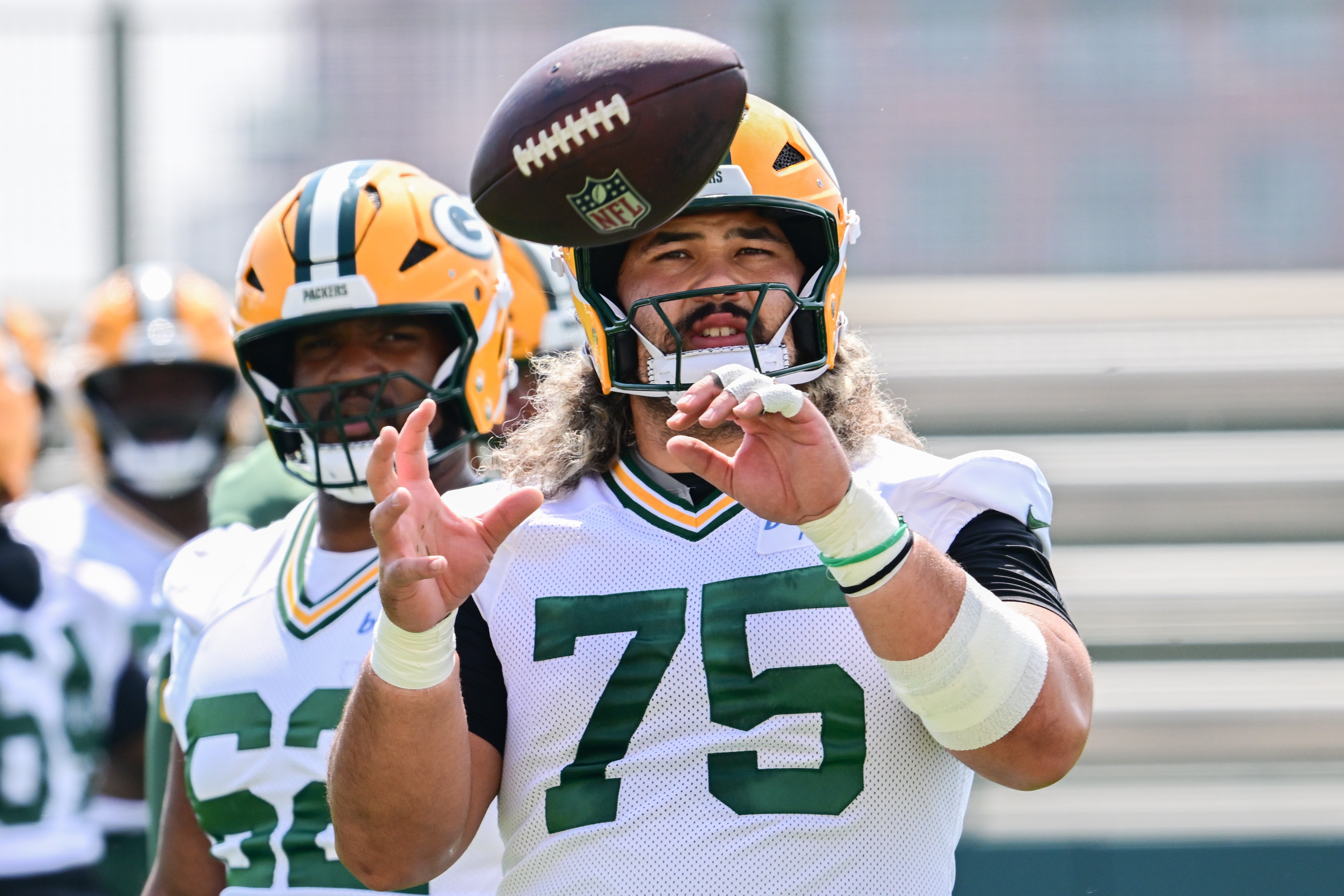 Green Bay Packers offensive lineman Sean Rhyan (75) participates in the team's minicamp at Ray Nitschke Field.