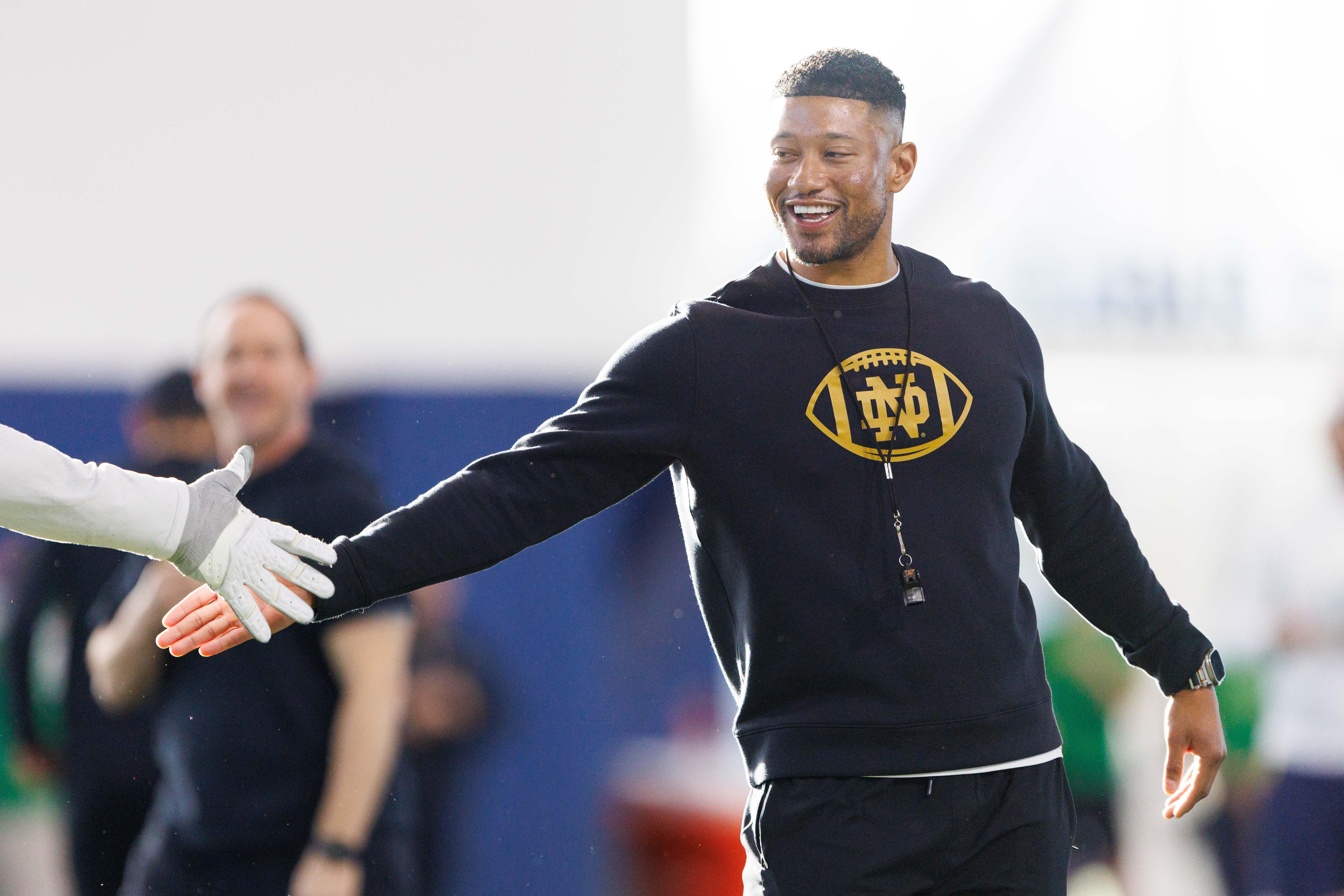 Notre Dame head coach Marcus Freeman greets his players during a Notre Dame football spring practice at Irish Athletic Center on Wednesday, March 19, 2025, in South Bend.