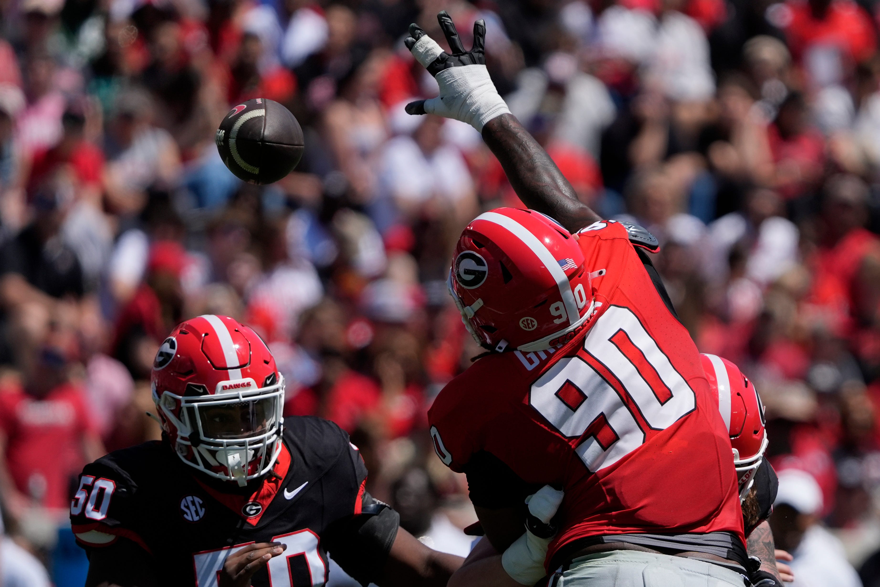 Georgia defensive lineman Elijah Griffin (90) goes up to bat down a pass during the Georgia G-Day spring football game in Athens, Ga., on Saturday, April 12, 2025.