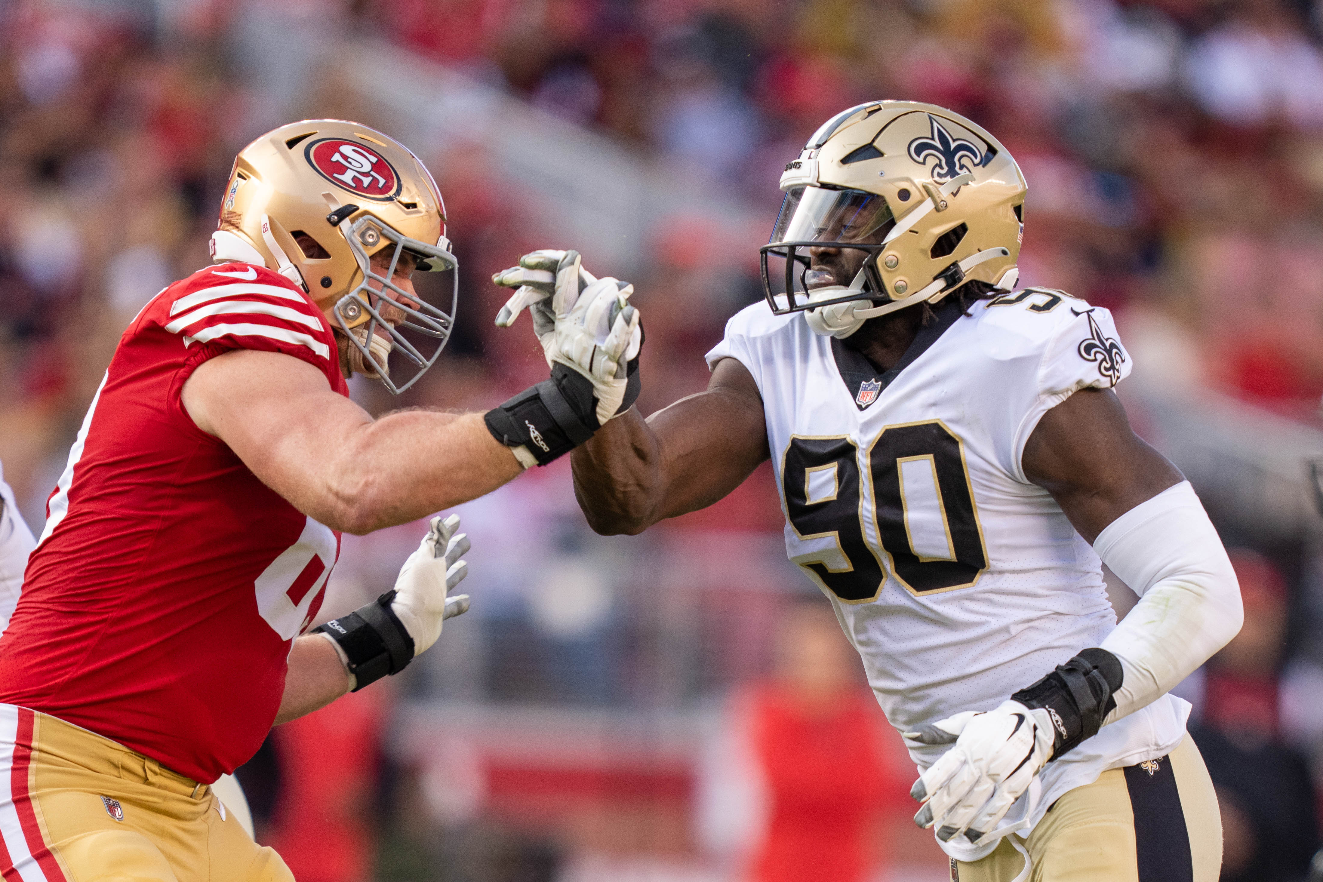 November 27, 2022; Santa Clara, California, USA; San Francisco 49ers offensive tackle Mike McGlinchey (69) against New Orleans Saints defensive end Tanoh Kpassagnon (90) during the second quarter at Levi's Stadium.