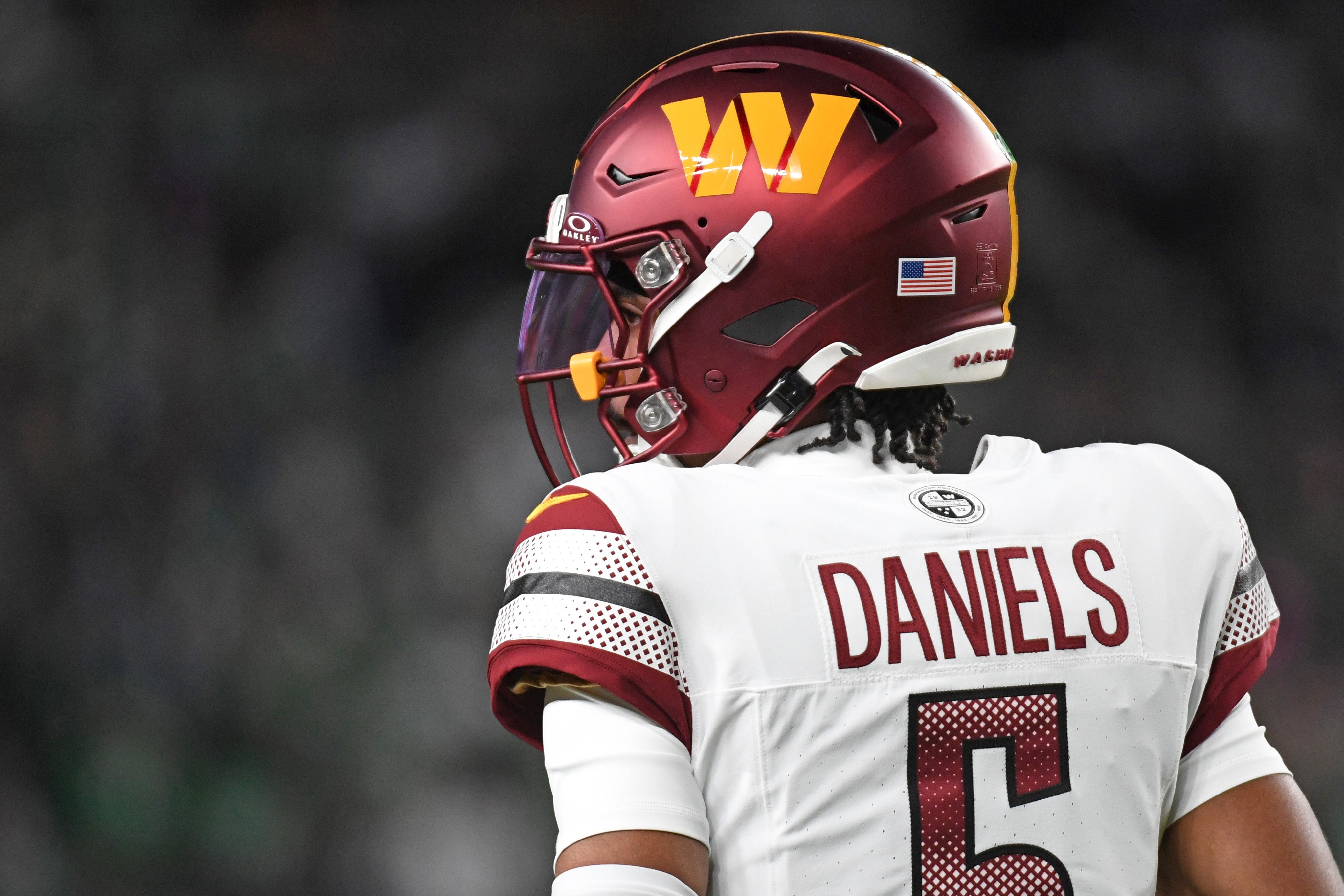 Nov 14, 2024; Philadelphia, Pennsylvania, USA; Washington Commanders quarterback Jayden Daniels (5) against the Philadelphia Eagles at Lincoln Financial Field.