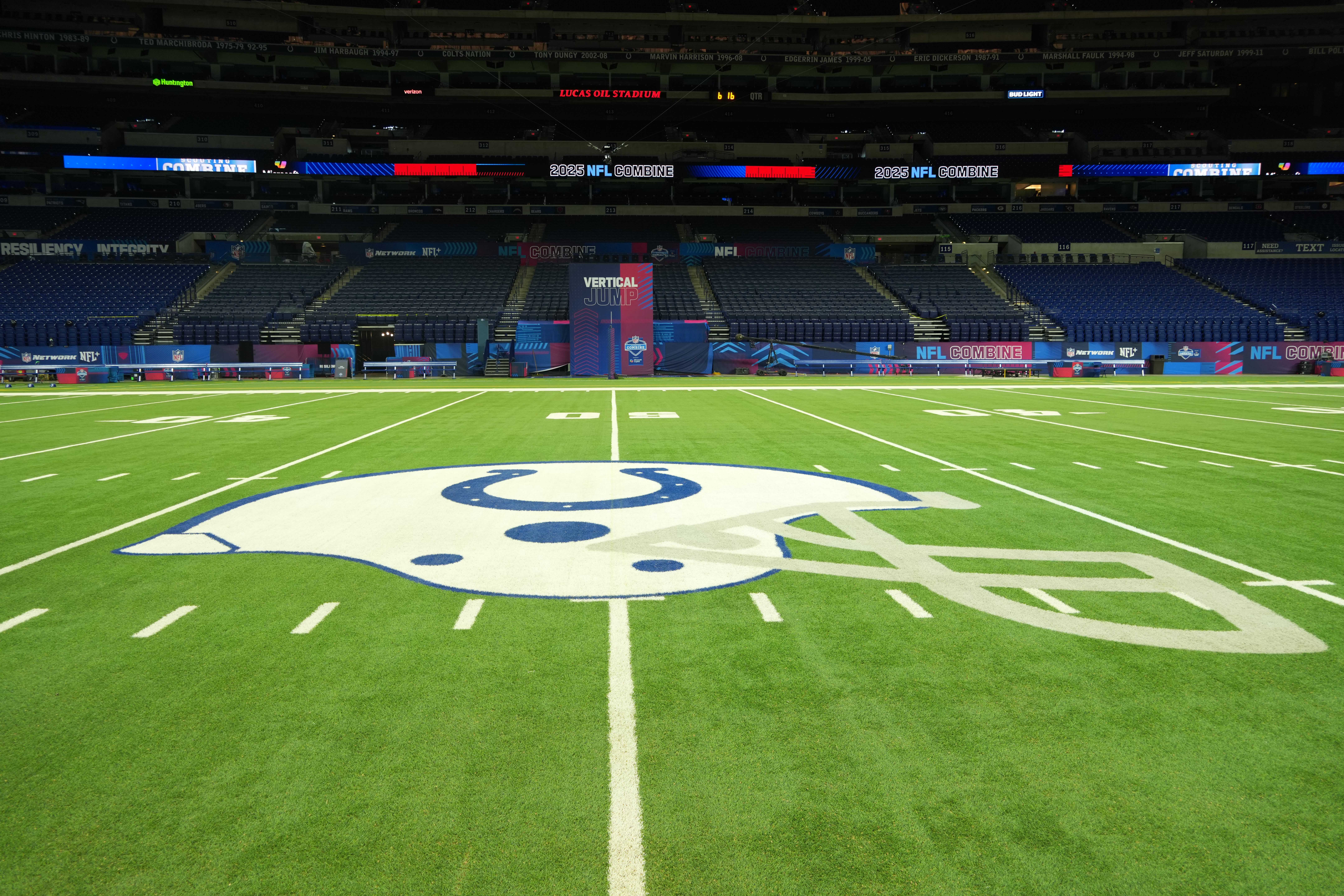 Feb 25, 2025; Indianapolis, IN, USA; The Indianapolis Colts helmet logo at midfield at Lucas Oil Stadium.