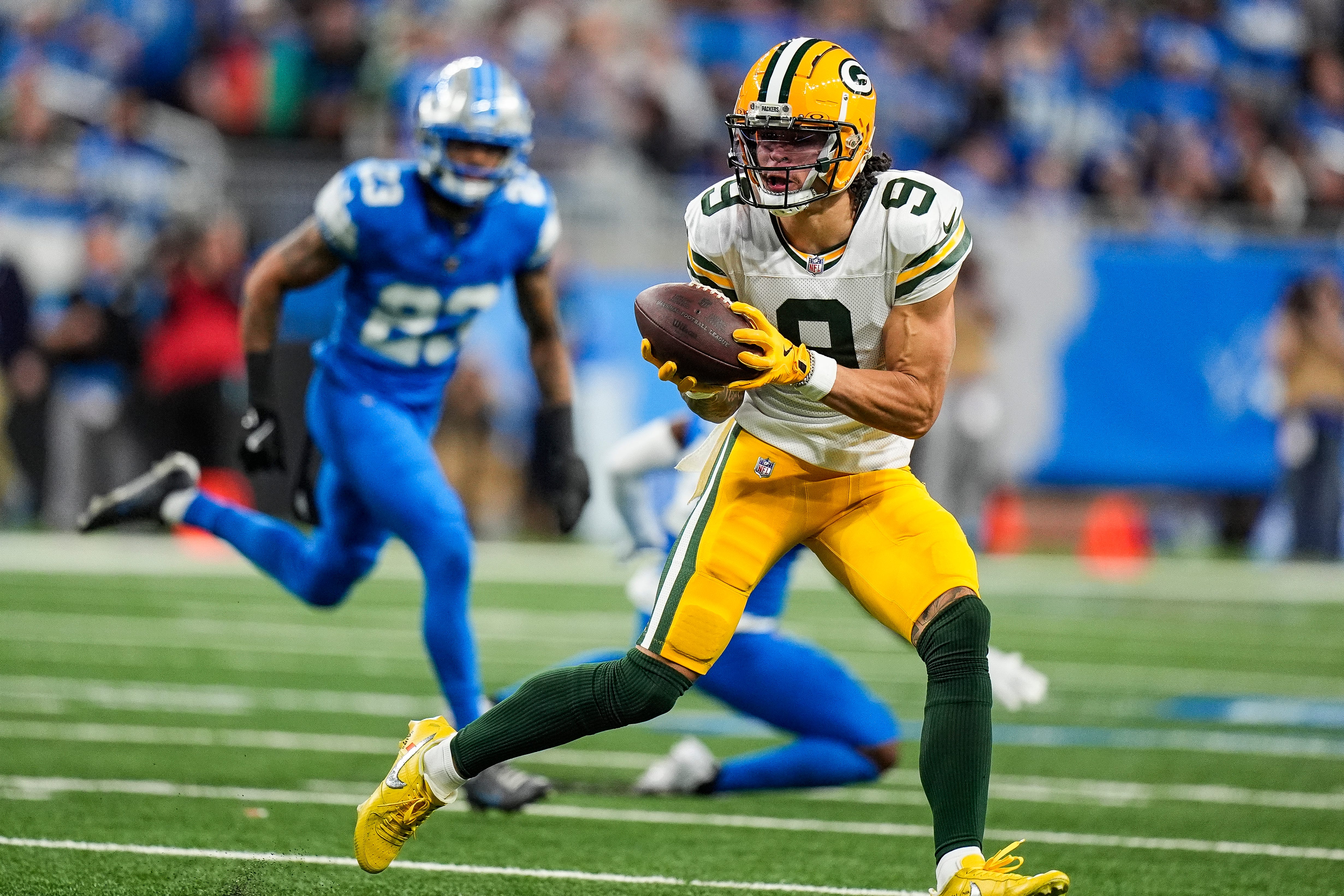 Green Bay Packers wide receiver Christian Watson (9) makes a catch against Detroit Lions during the first half at Ford Field in Detroit on Thursday, Dec. 5, 2024.