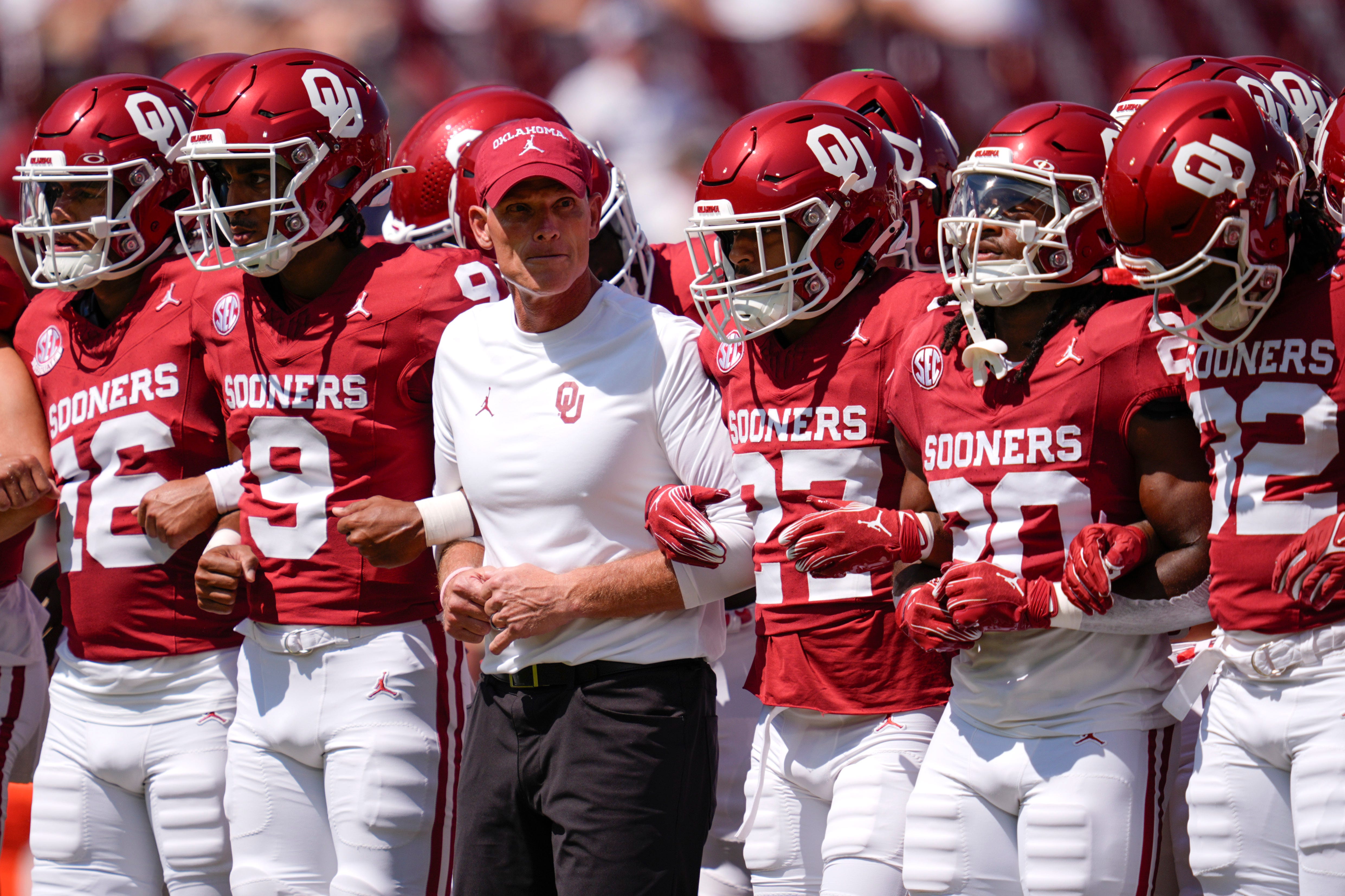 Oklahoma coach Brent Venable lines up with his players before during a college football game between the University of Oklahoma Sooners (OU) and the Tulane Green Wave at Gaylord Family - Oklahoma Memorial Stadium in Norman, Okla., Saturday, Sept. 14, 2024.