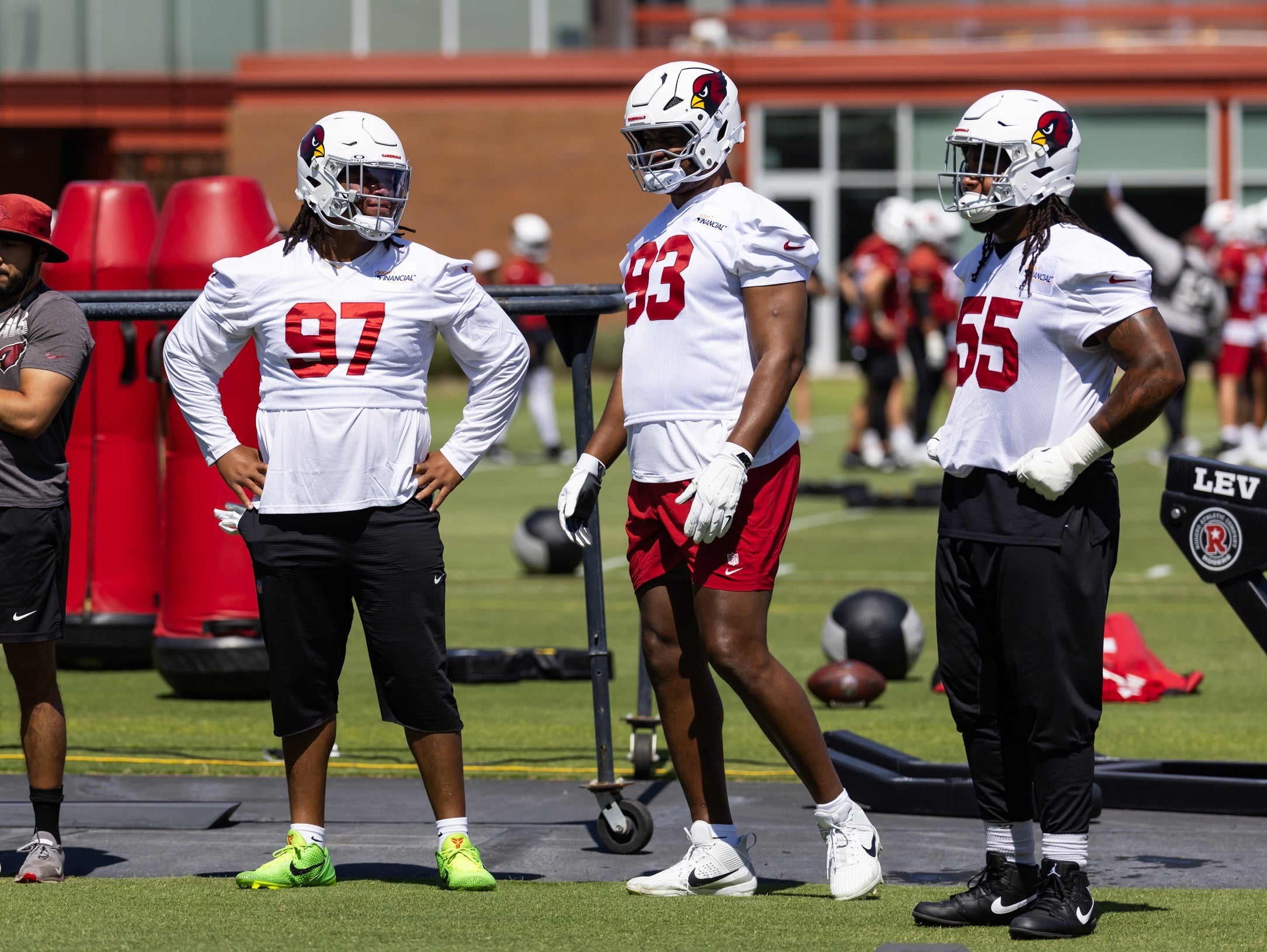 Arizona Cardinals defensive lineman Walter Nolen III (97) talks with Calais Campbell (93) and Dante Stills (55) during minicamp at the teams Arizona Cardinals Training Facility.