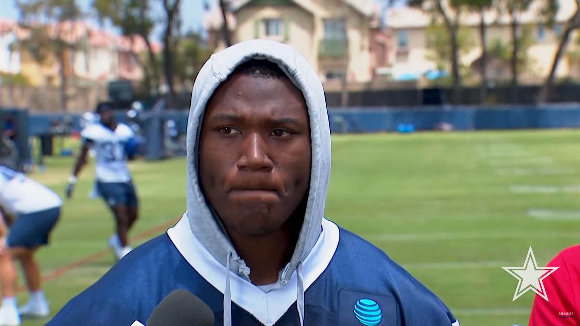 Dallas Cowboys LB Kenneth Murray talks to reporters at training camp.