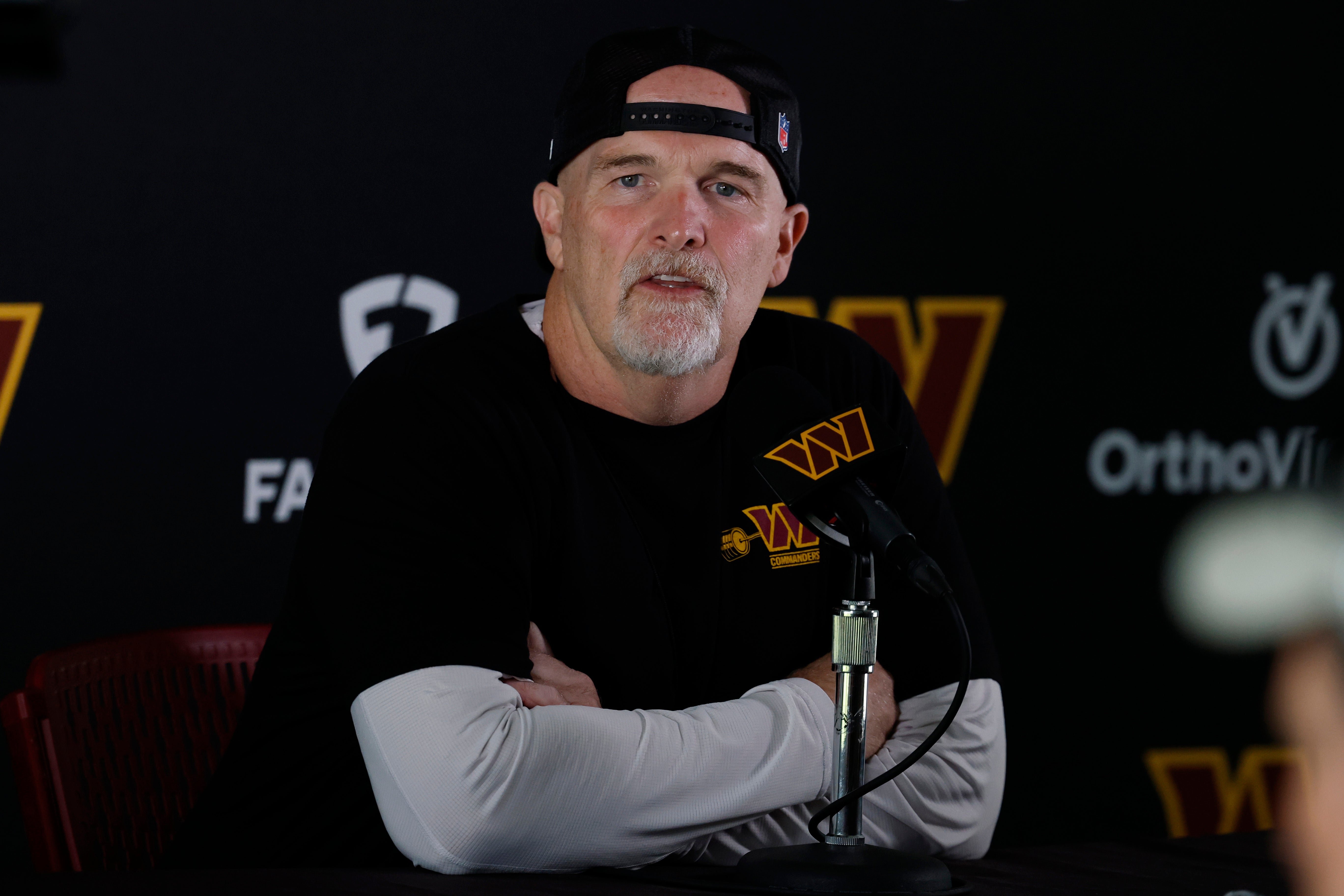 Jul 23, 2025; Ashburn, VA, USA; Washington Commanders head coach Dan Quinn speaks with the media prior to practice on day one of training camp at OrthoVirginia Training Center at Commanders Park.
