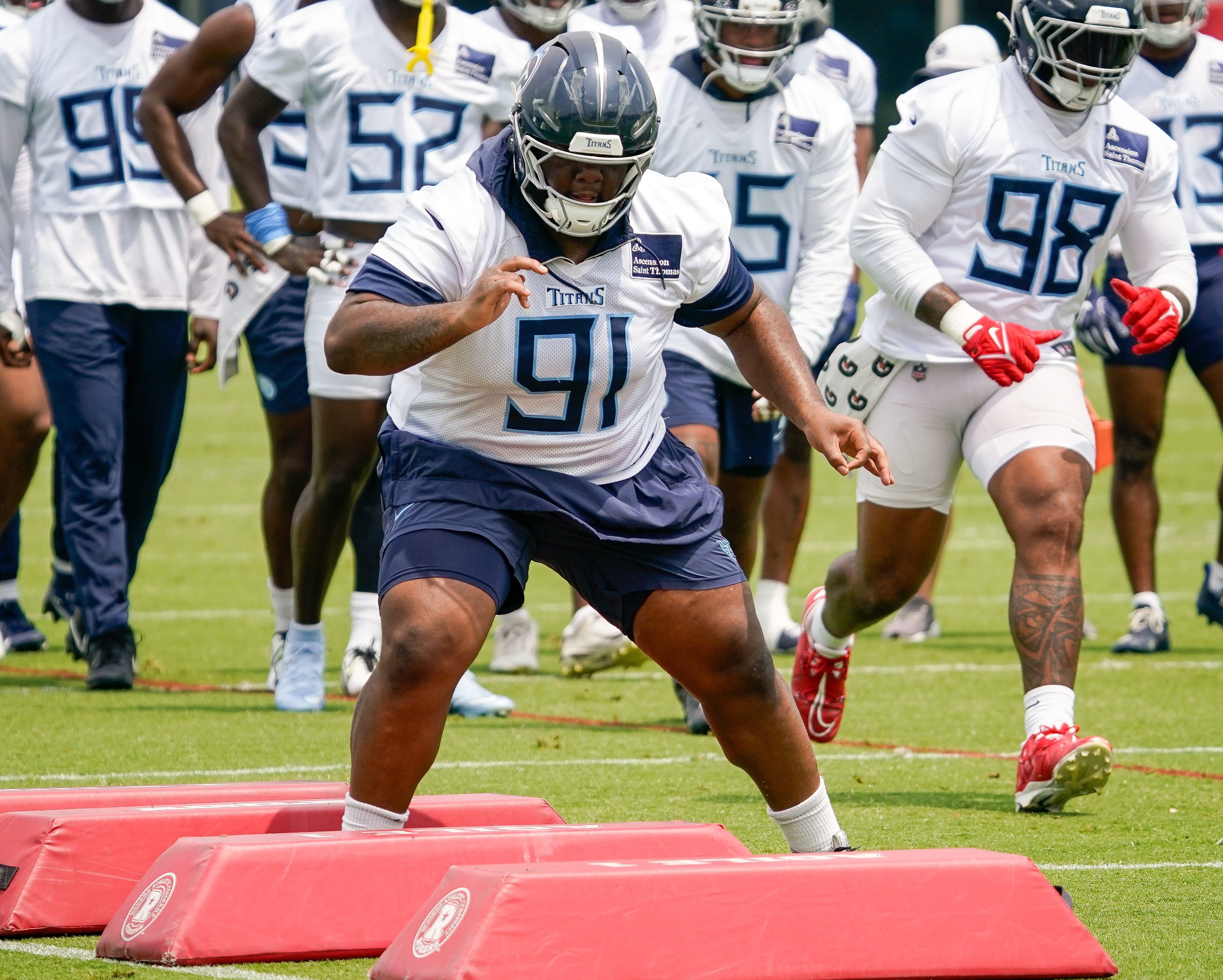 Tennessee Titans defensive lineman Keondre Coburn (91) runs drills during minicamp practice at Ascension Saint Thomas Sports Park in Nashville, Tenn., Wednesday, June 11, 2025.