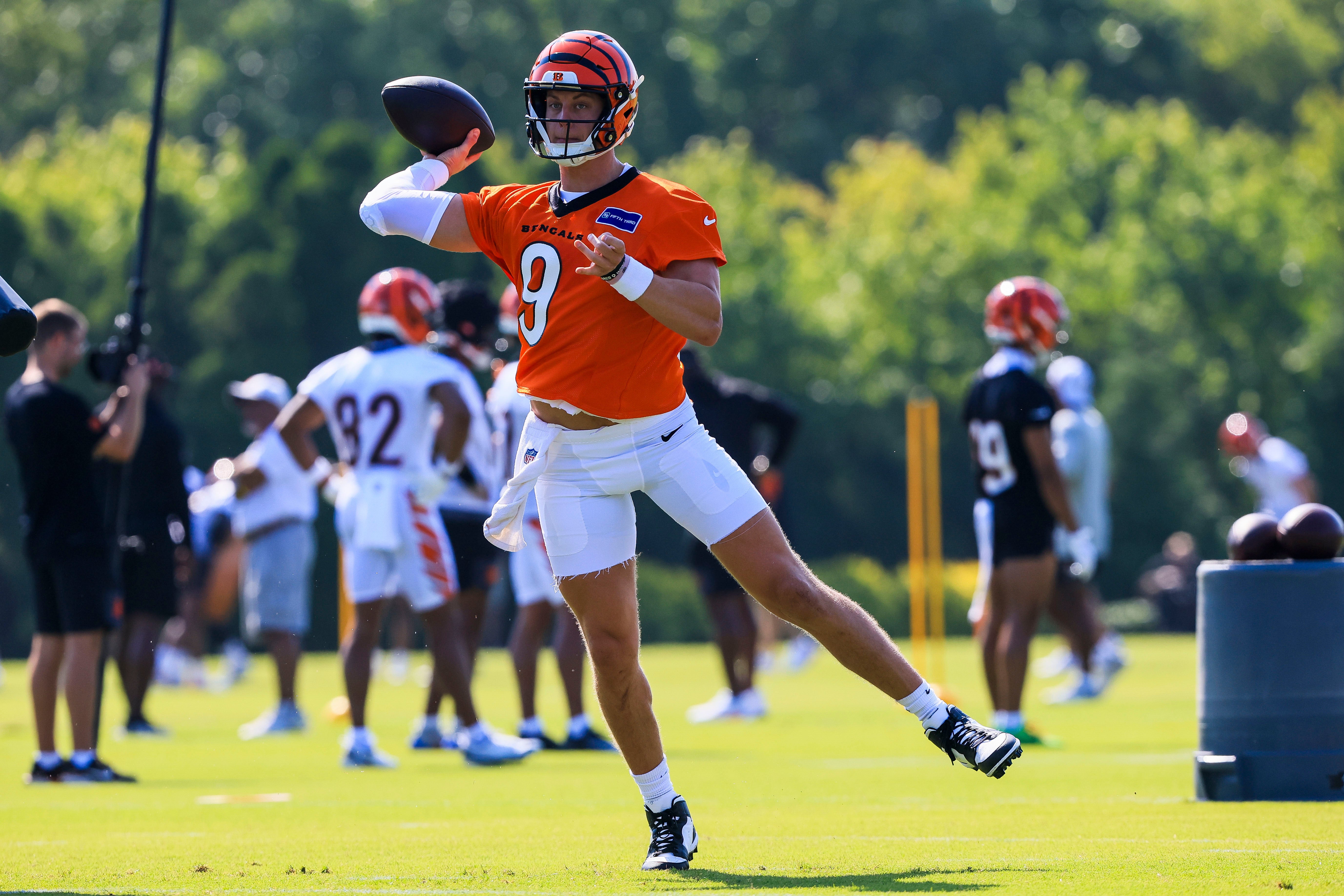 Jul 23, 2025; Cincinnati, OH, USA; Cincinnati Bengals quarterback Joe Burrow (9) throws a pass during training camp at Kettering Health Practice Field. Mandatory Credit: Katie Stratman-Imagn Images