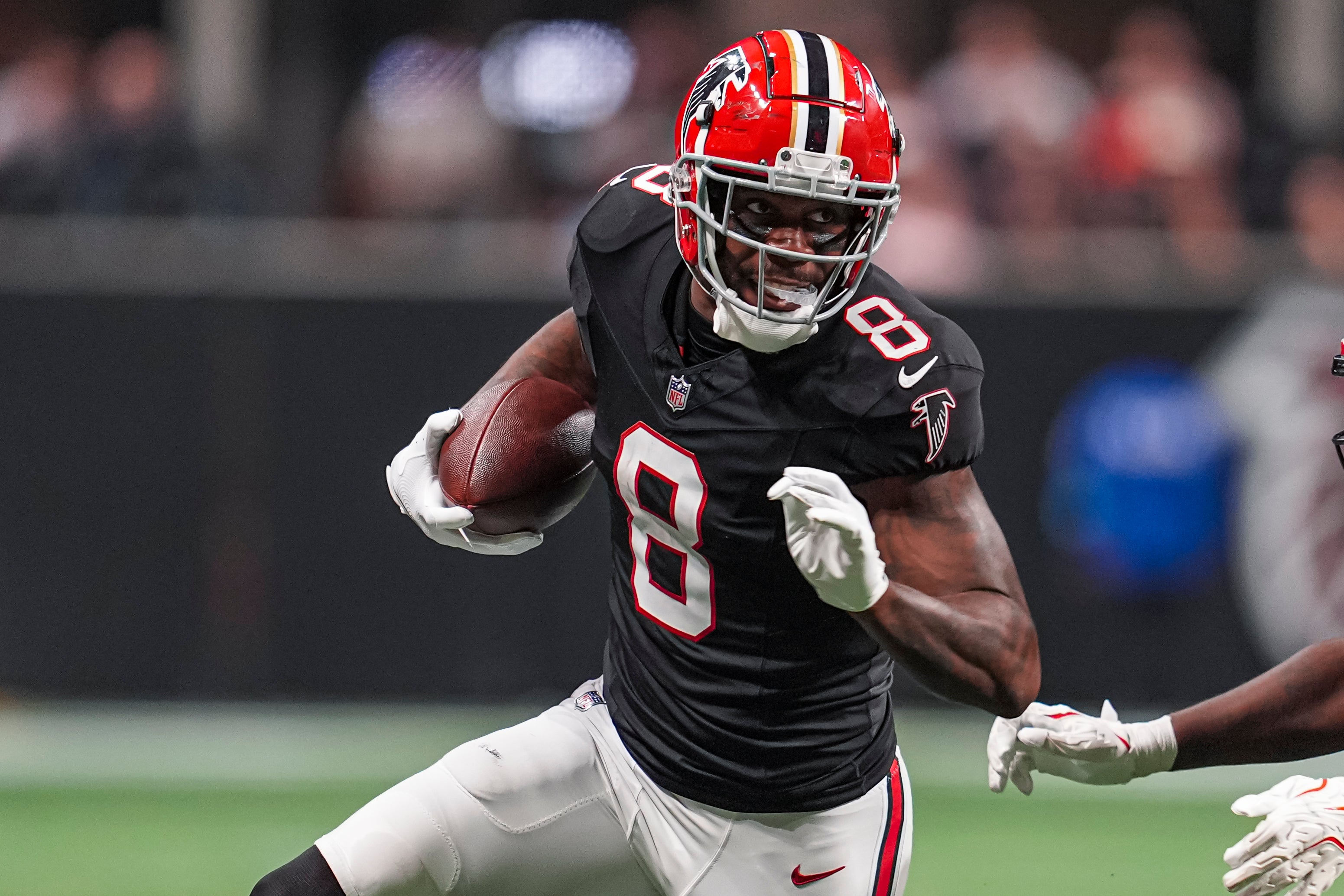 Oct 3, 2024; Atlanta, Georgia, USA; Atlanta Falcons tight end Kyle Pitts (8) runs against the Tampa Bay Buccaneers after a catch at Mercedes-Benz Stadium.