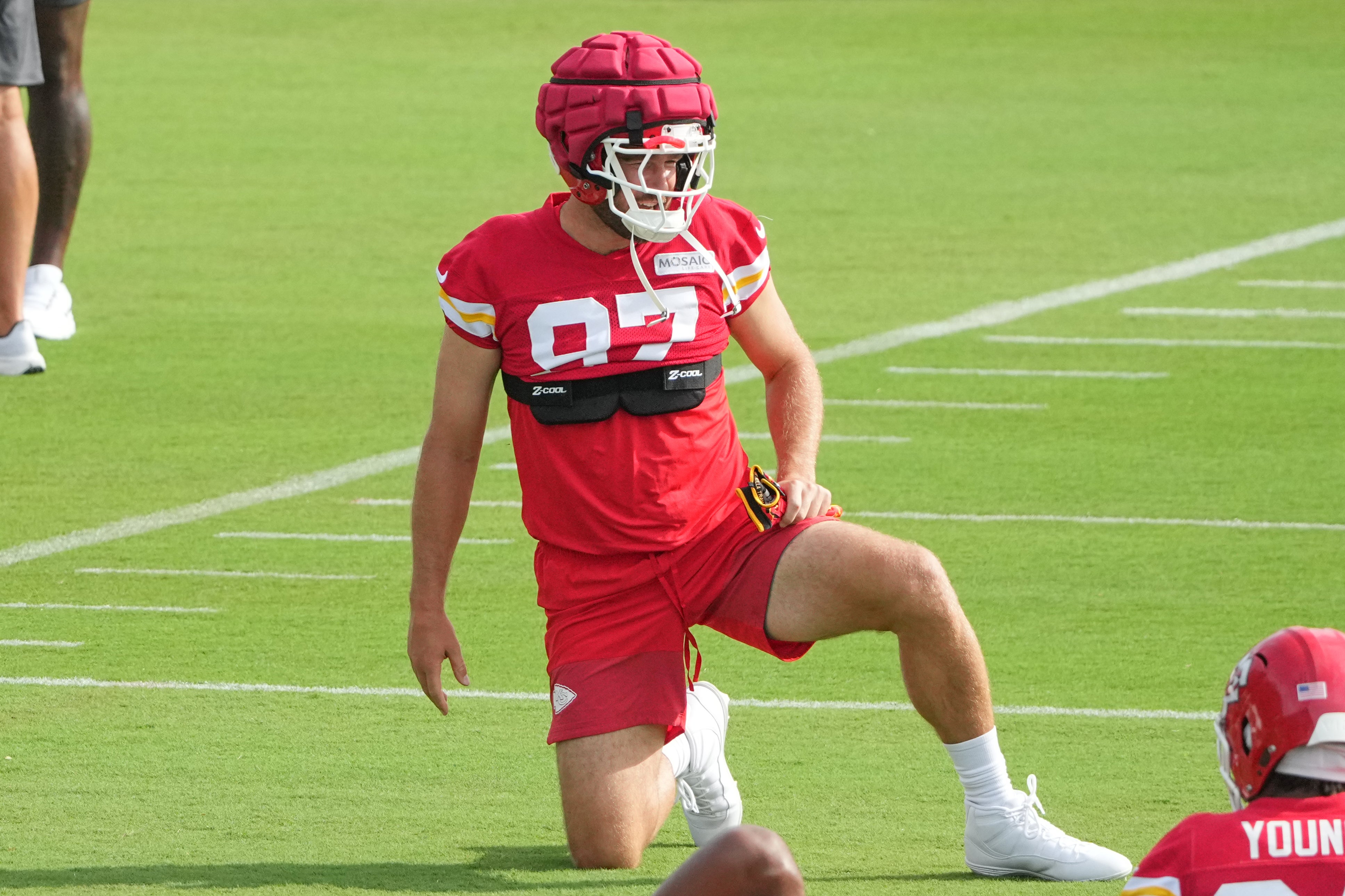 Jul 22, 2025; St. Joseph, MO, USA; Kansas City Chiefs tight end Travis Kelce (87) stretches out during training camp at Missouri Western State University.