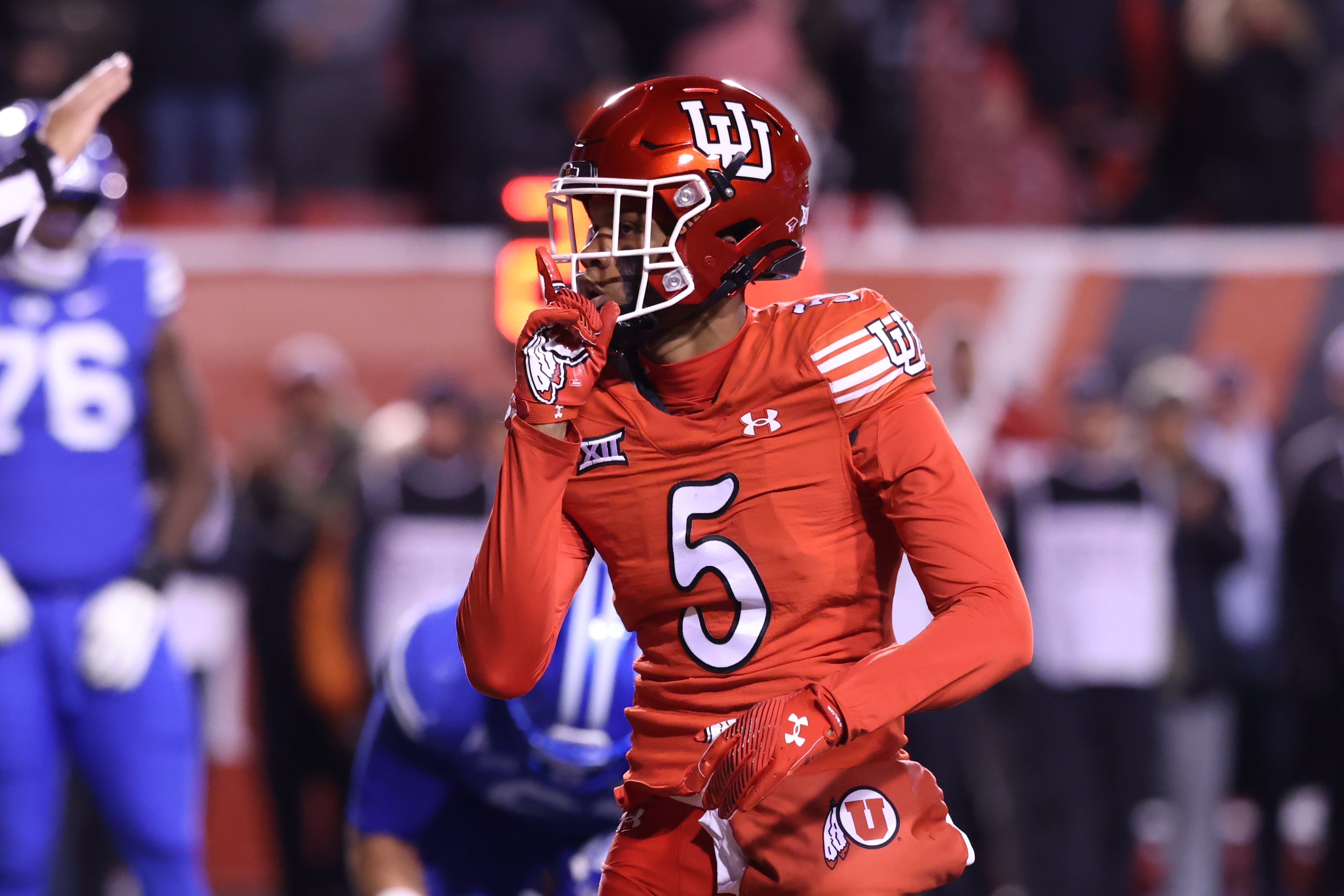 Nov 9, 2024; Salt Lake City, Utah, USA; Utah Utes cornerback Zemaiah Vaughn (5) reacts after a sack against the Brigham Young Cougars during the second half at Rice-Eccles Stadium.