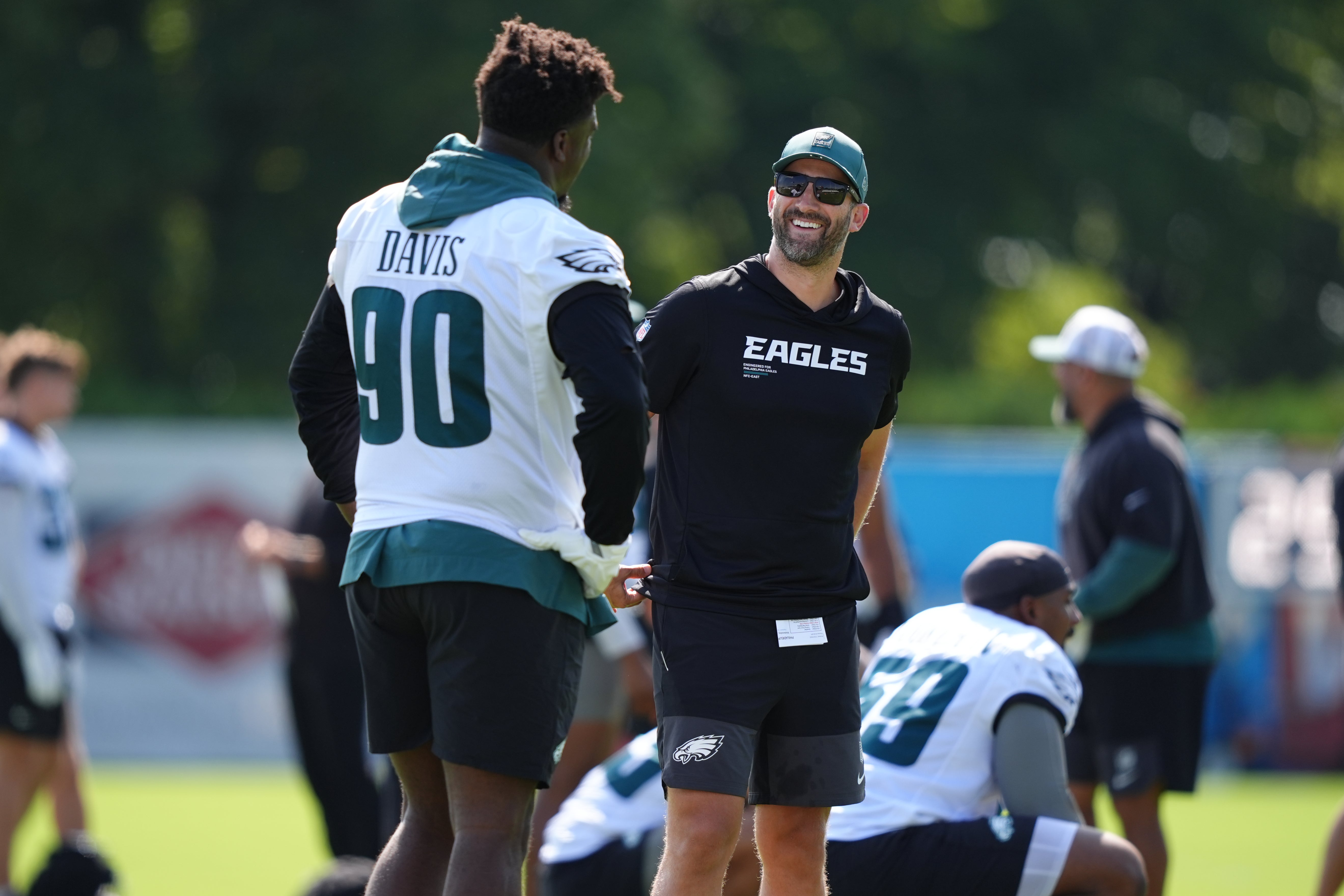 Philadelphia Eagles head coach Nick Sirianni reacts with defensive tackle Jordan Davis (90) during training camp at NovaCare Complex.