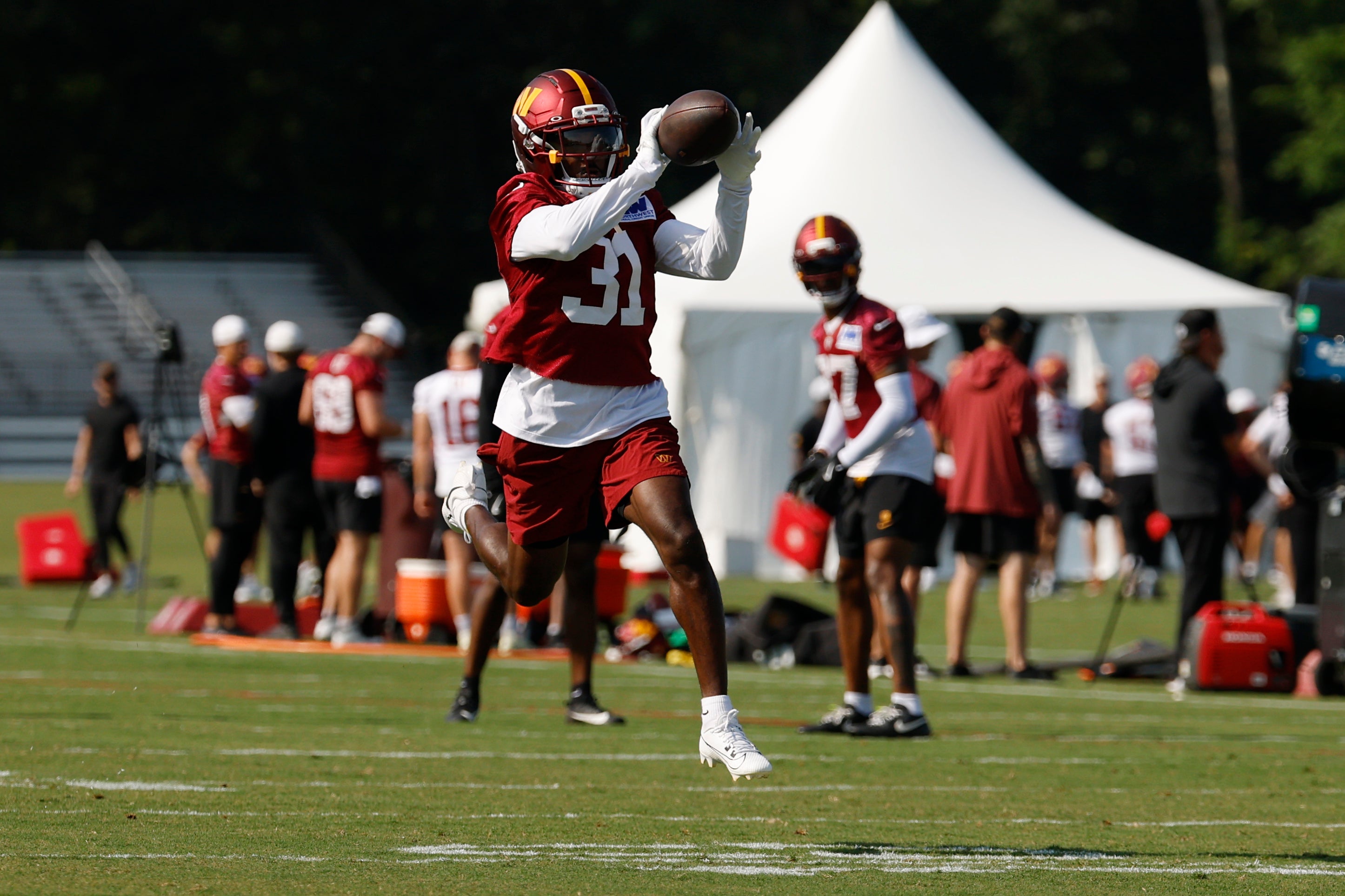 Jul 24, 2025; Ashburn, VA, USA; Washington Commanders cornerback Jonathan Jones (31) catches a ball during practice on day two of training camp at OrthoVirginia Training Center at Commanders Park.