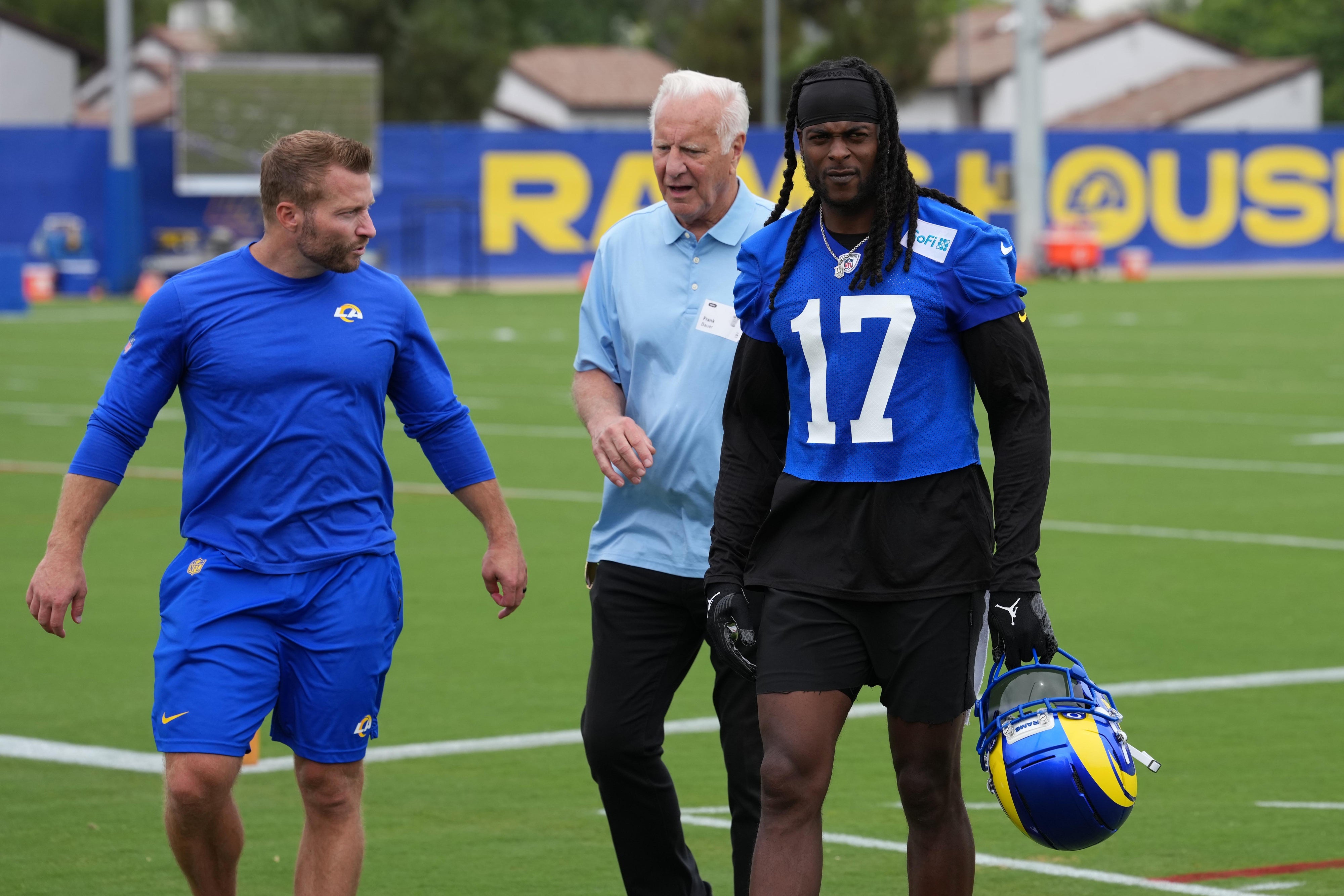 Los Angeles Rams coach Sean McVay (left) and receiver Davante Adams (17) talks with sports agent Frank Bauer (center) during organized team activities at Rams Practice Facility.