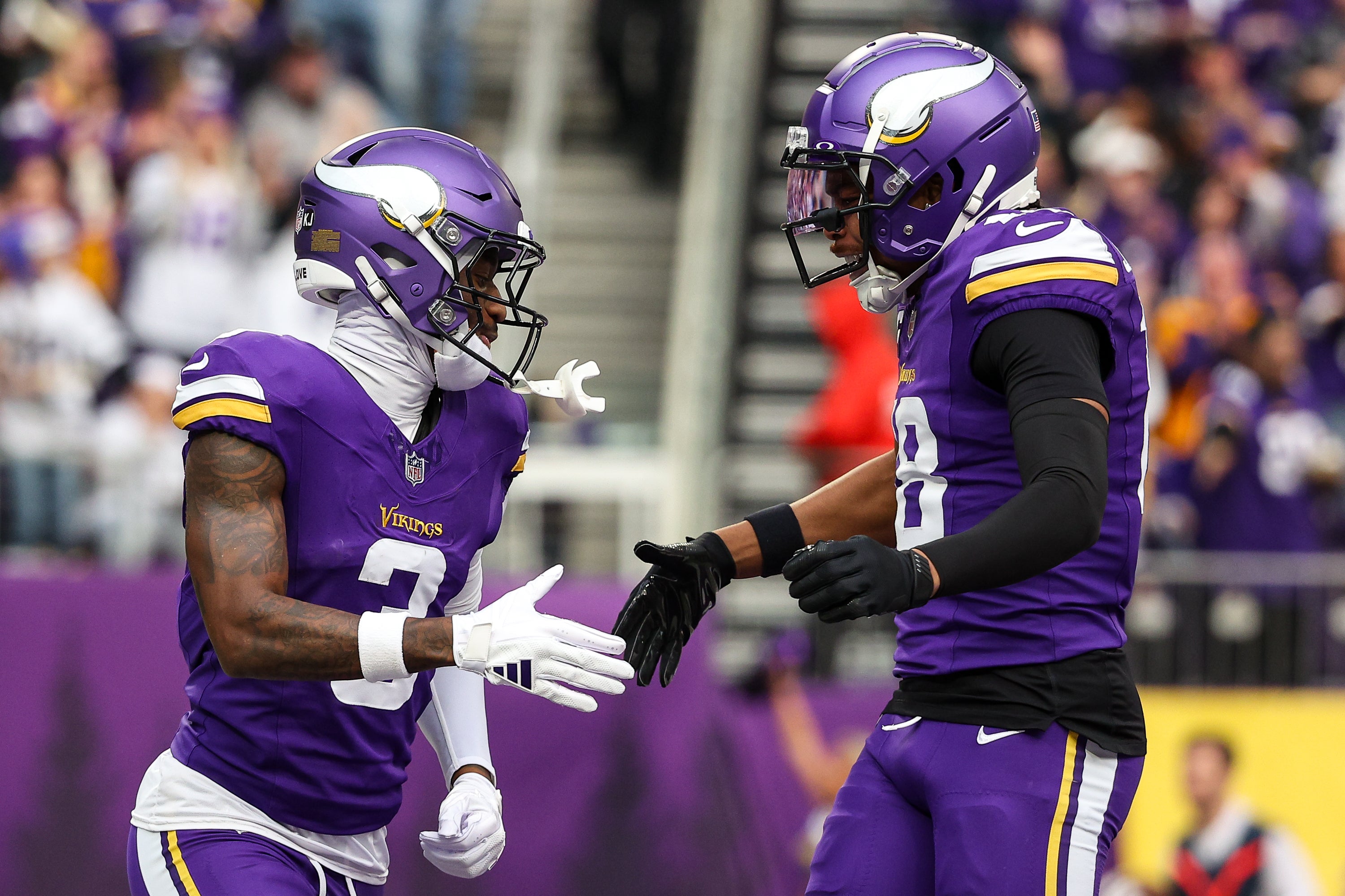 Dec 8, 2024; Minneapolis, Minnesota, USA; Minnesota Vikings wide receiver Jordan Addison (3) celebrates his touchdown with wide receiver Justin Jefferson (18) against the Atlanta Falcons during the first quarter at U.S. Bank Stadium.