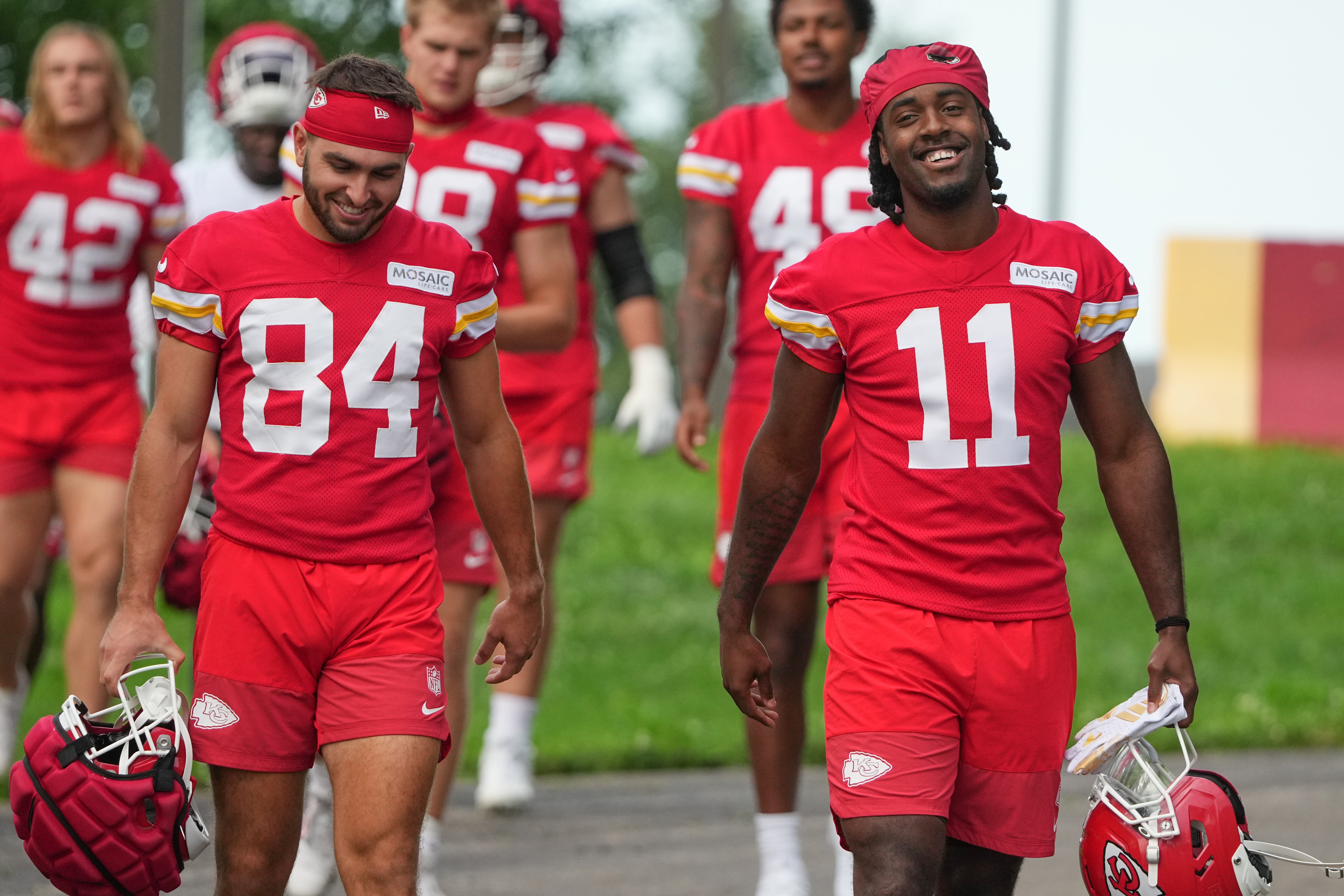 Jul 22, 2025; St. Joseph, MO, USA; Kansas City Chiefs wide receivers Mac Dalena (84) and Jalen Royals (11) walk down the hill to the practice fields during training camp at Missouri Western State University.