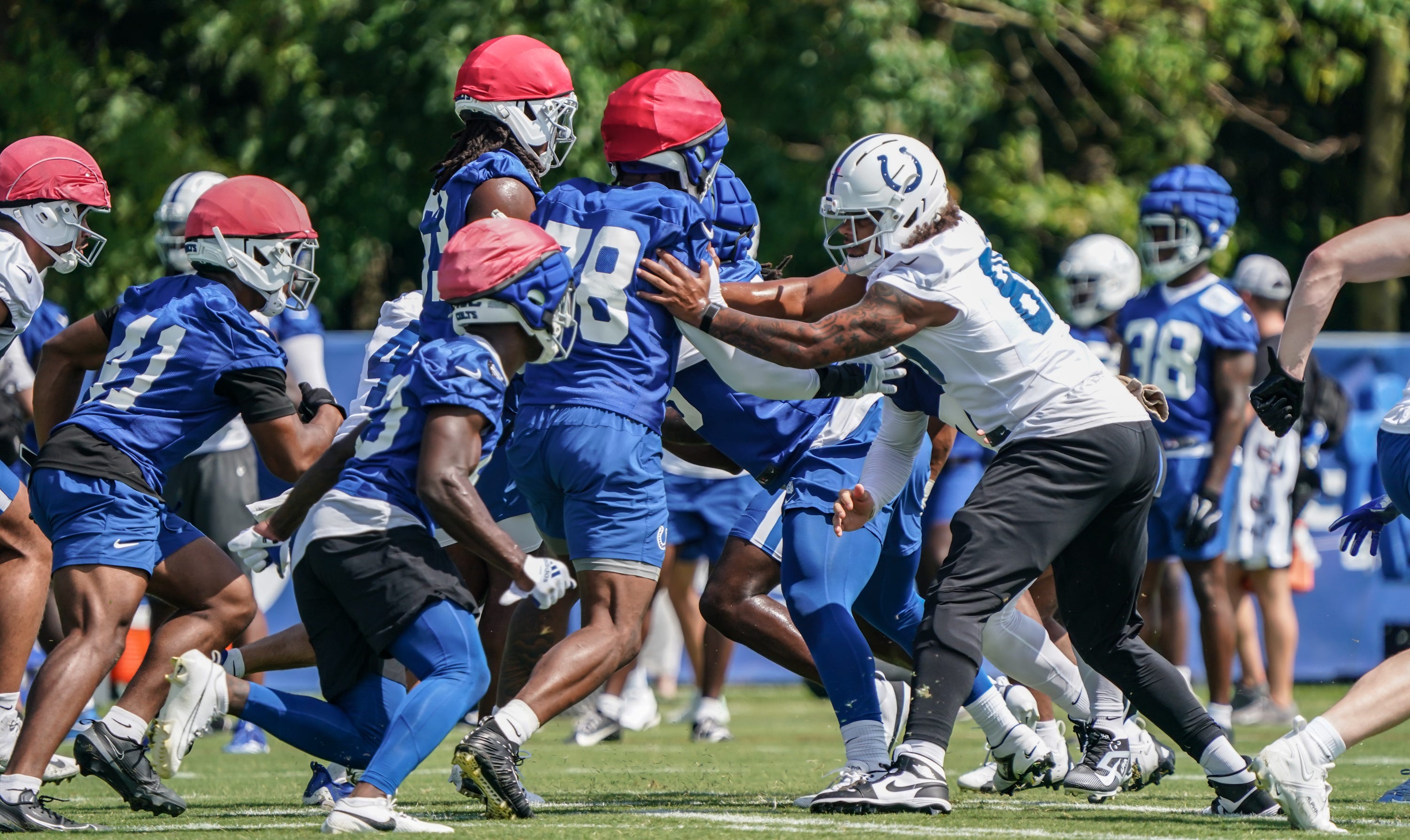 Indianapolis Colts players run drills during training camp at Grand Park on Saturday, July 26, 2025, in Westfield, Ind.