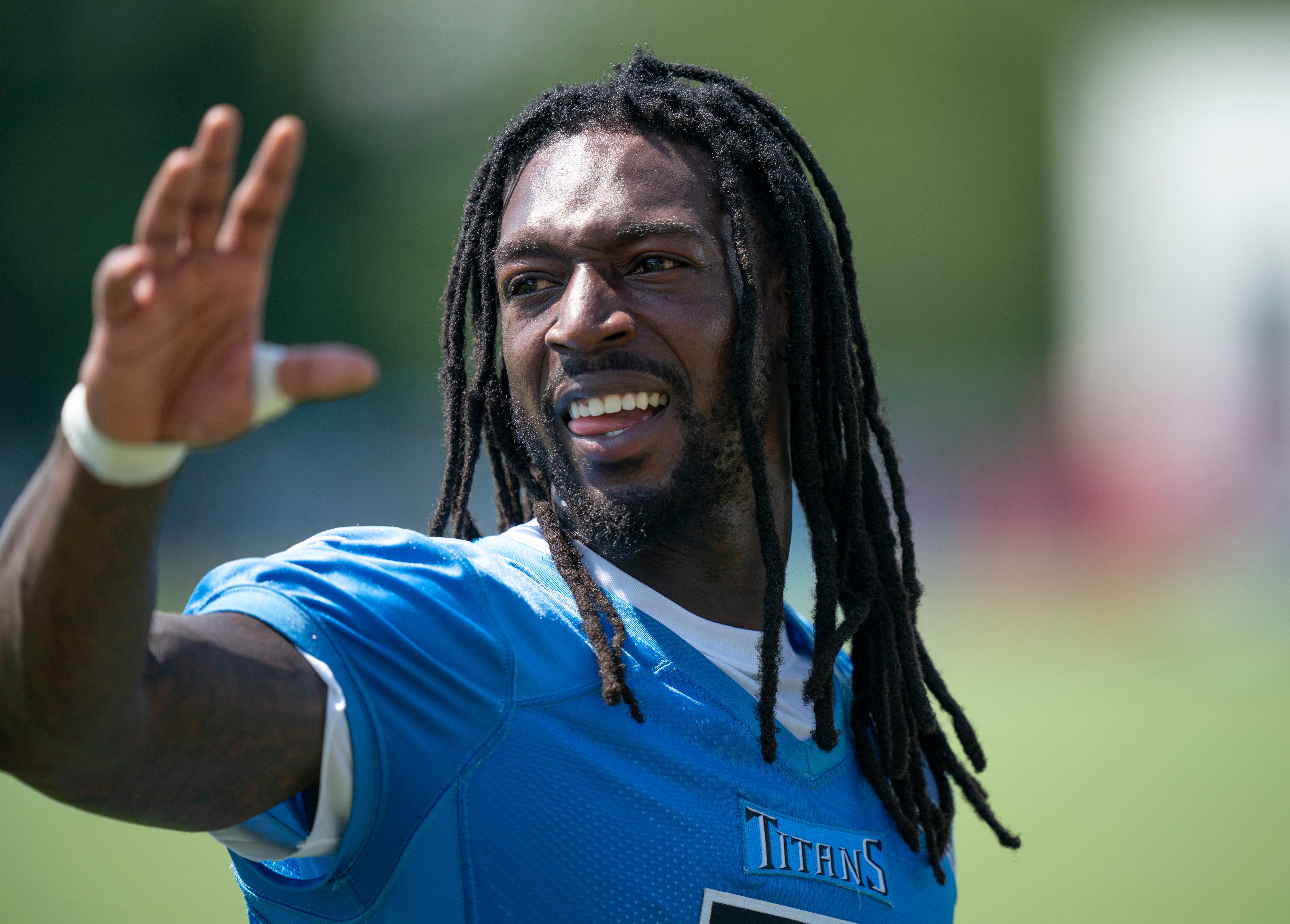 Tennessee Titans wide receiver Calvin Ridley (0) acknowledges a fan after the Tennessee Titans first day of training camp at Ascension Saint Thomas Sports Park in Nashville, Tenn., Wednesday, July 23, 2025.