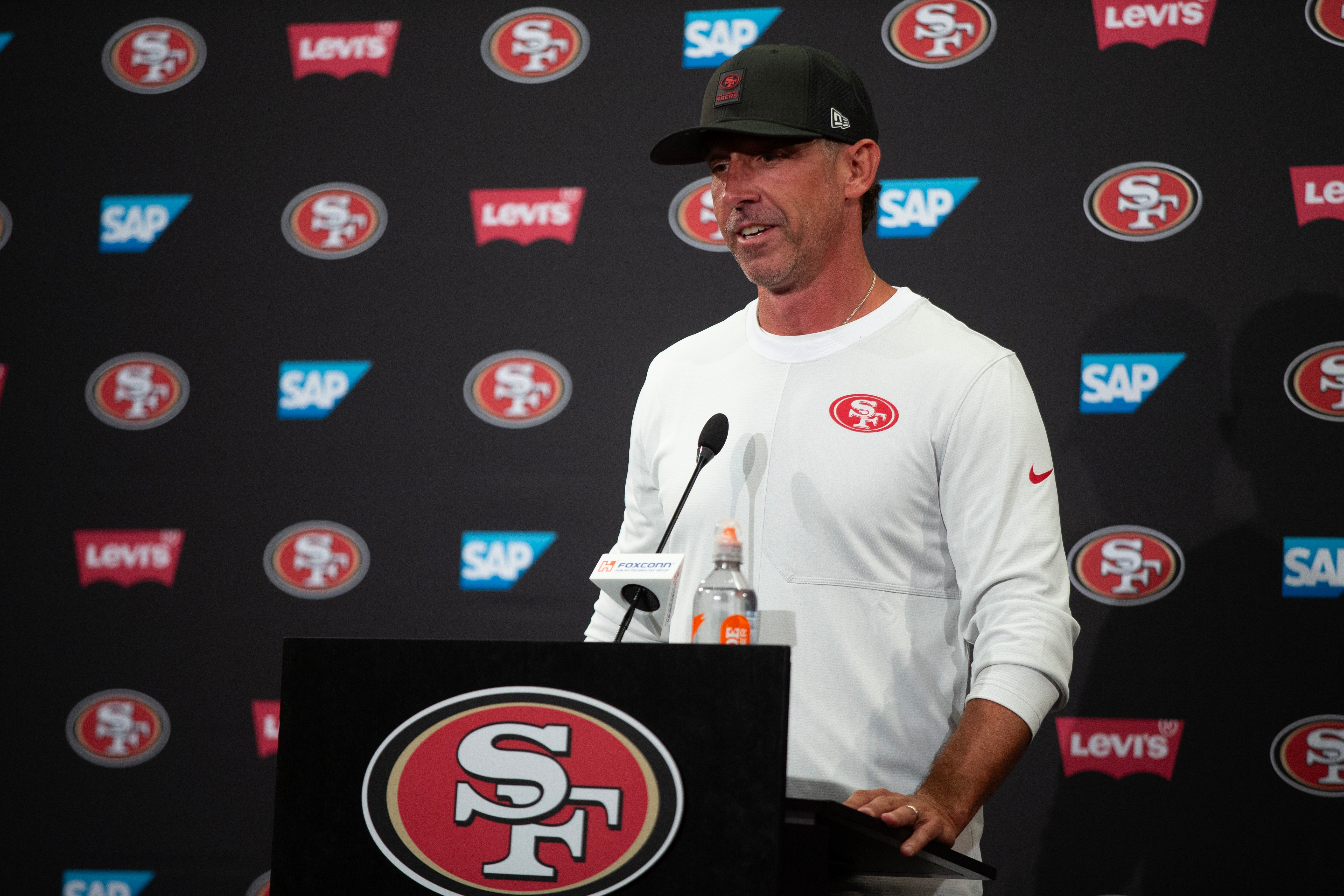 Jul 23, 2025; Santa Clara, CA, USA; San Francisco 49ers head coach Kyle Shanahan answers questions from reporters following the first day of training camp at SAP Performance Facility.