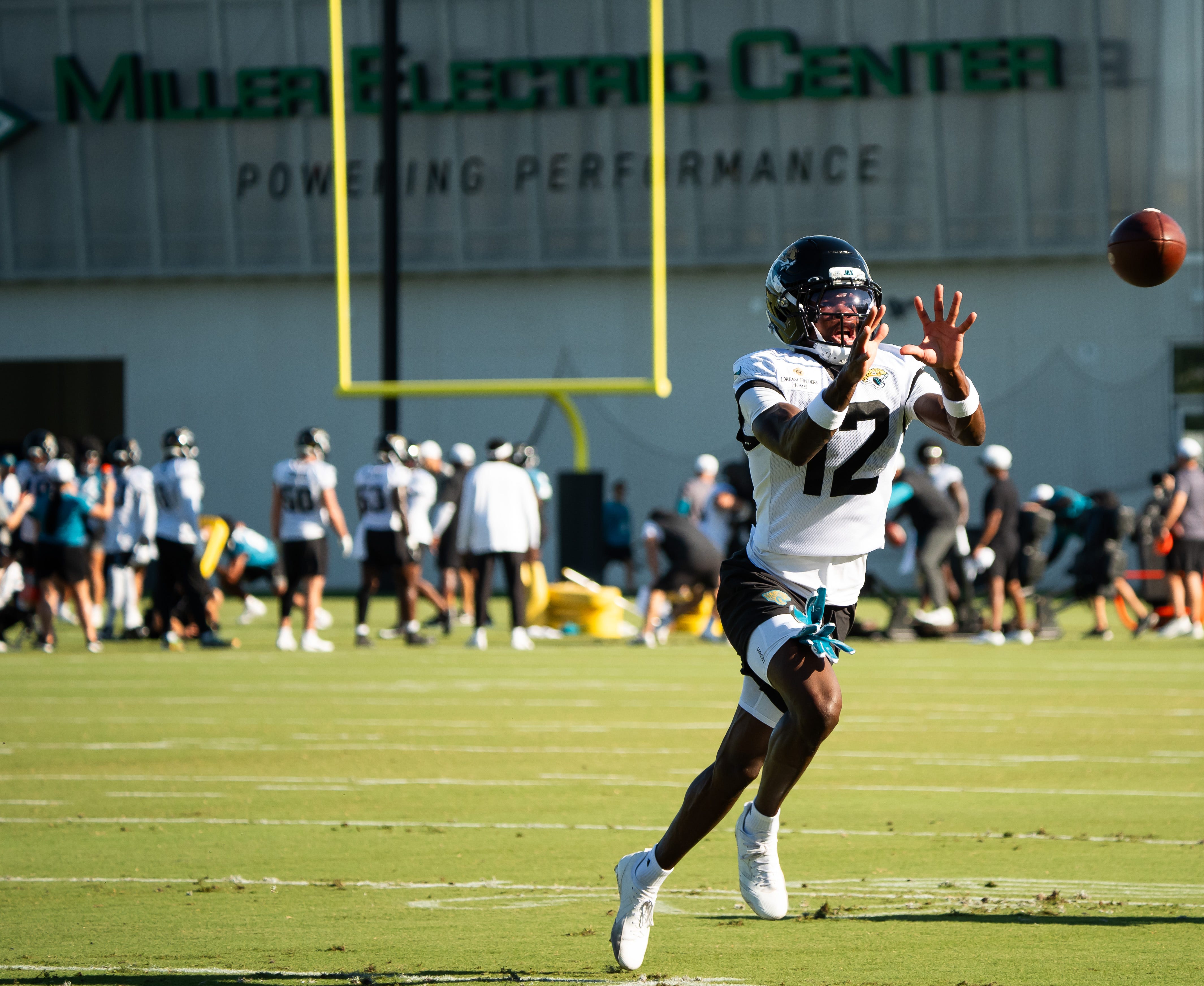 Jacksonville Jaguars wide receiver Travis Hunter (12) hauls in a pass during a drill during an NFL training camp fourth session at the Miller Electric Center