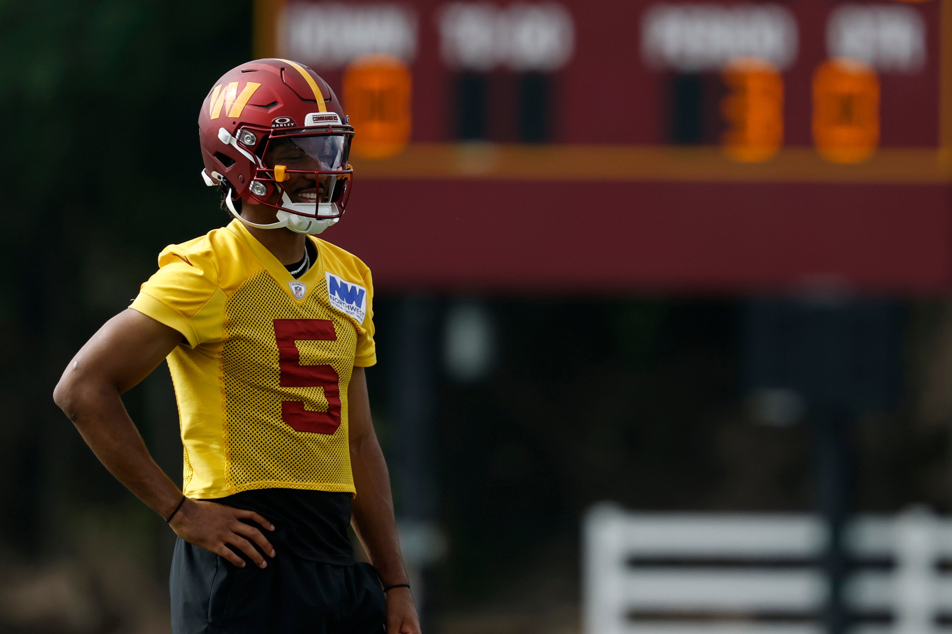 Jul 23, 2025; Ashburn, VA, USA; Washington Commanders quarterback Jayden Daniels (5) looks on during practice on day one of training camp at OrthoVirginia Training Center at Commanders Park.