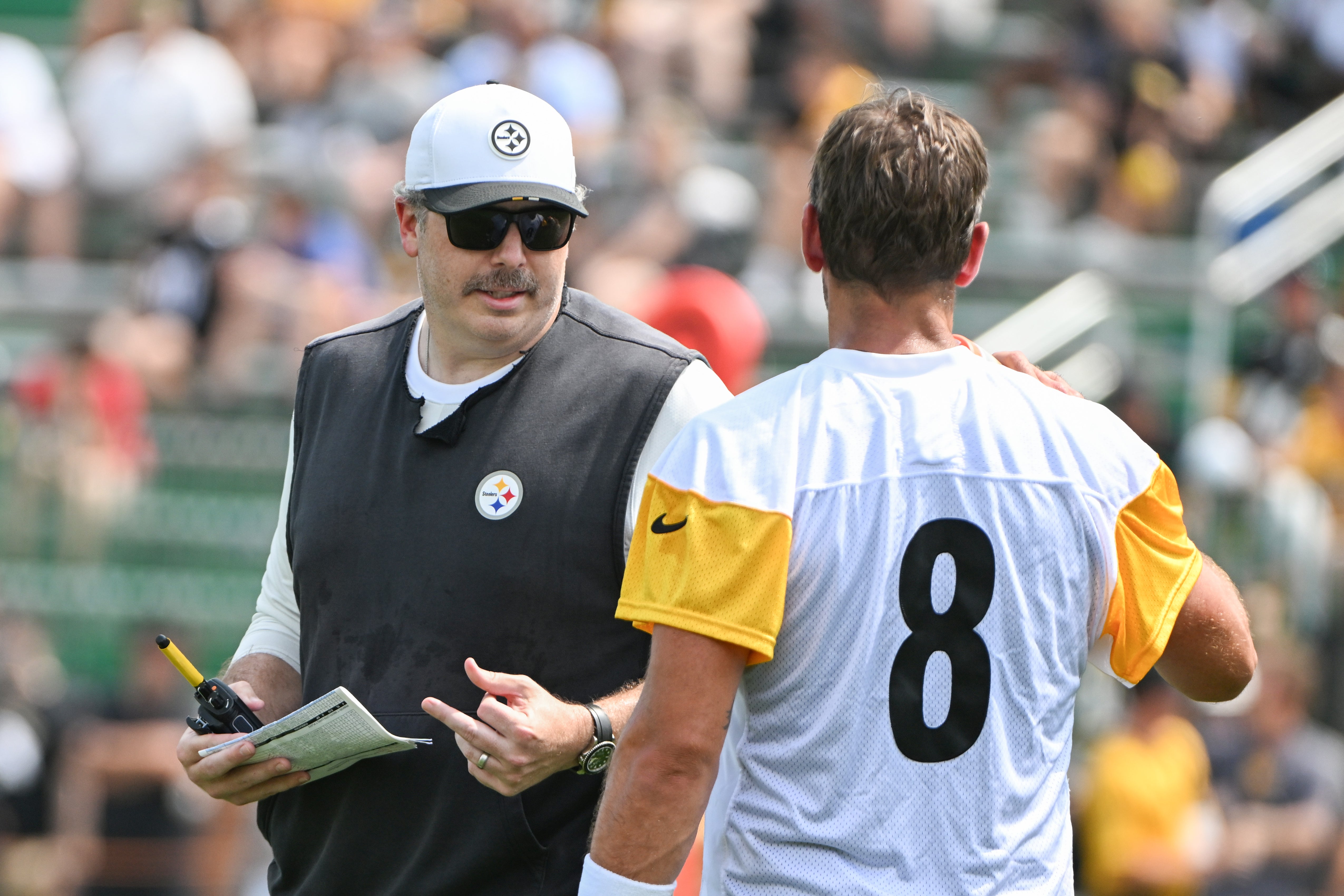 Jul 25, 2025; Pittsburgh, PA, USA; Pittsburgh Steelers offensive coordinator Arthur Smith talks with quarterback Aaron Rodgers (8) during drills at training camp at Saint Vincent College.