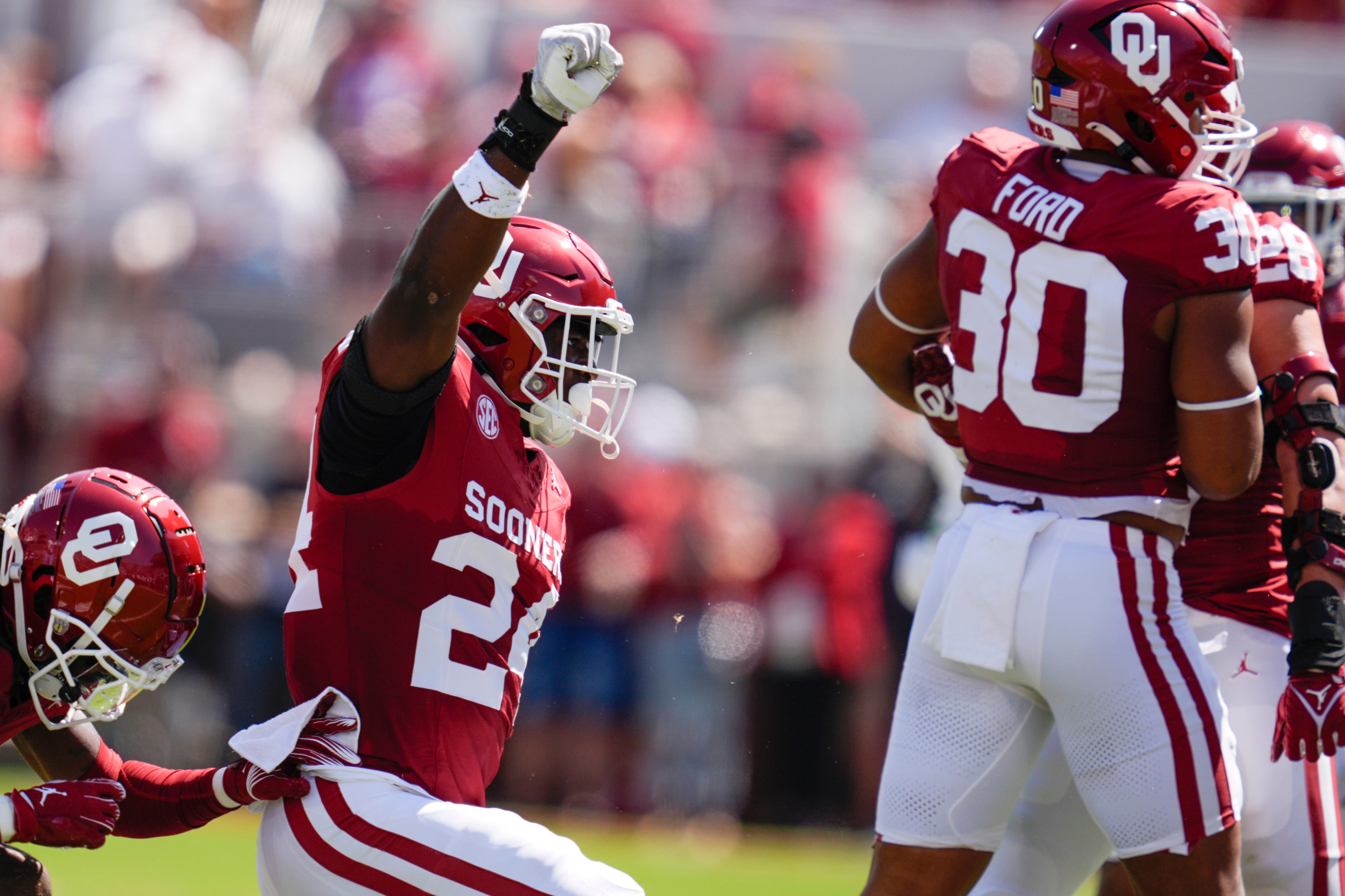Oklahoma Sooners linebacker Samuel Omosigho (24) celebrates after a tackle during a college football game between the University of Oklahoma Sooners (OU) and the Tulane Green Wave at Gaylord Family - Oklahoma Memorial Stadium in Norman, Okla., Saturday, Sept. 14, 2024.