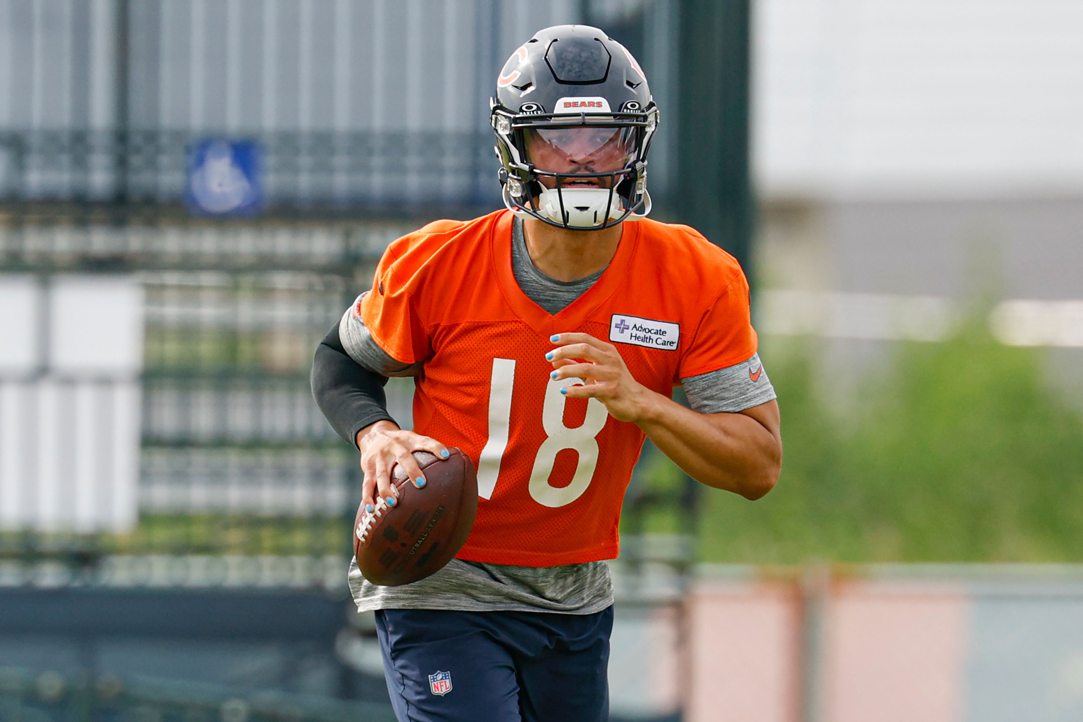 Jul 24, 2025; Lake Forest, IL, USA; Chicago Bears quarterback Caleb Williams (18) runs with the ball during training camp at Halas Hall.
