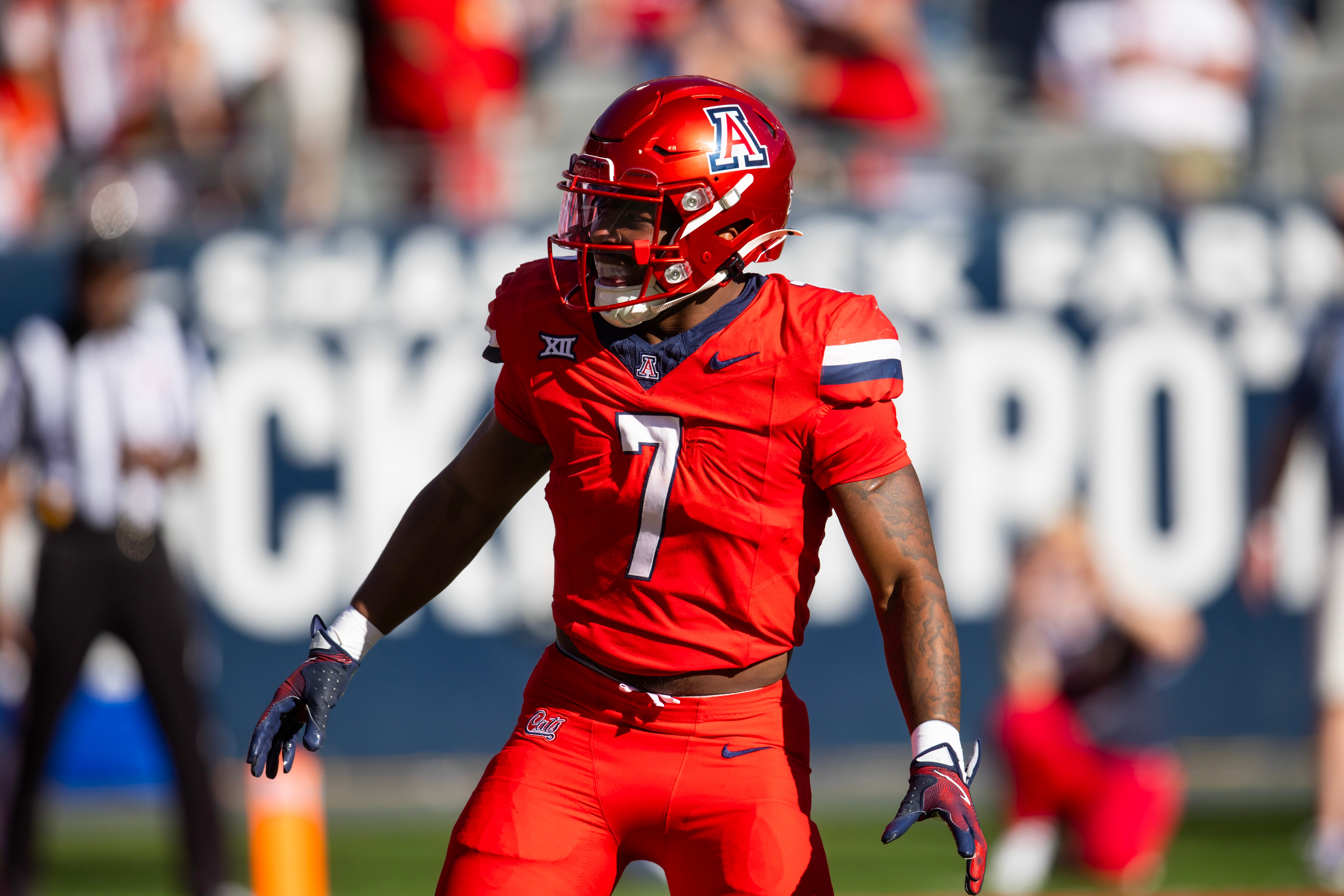 Nov 30, 2024; Tucson, Arizona, USA; Arizona Wildcats running back Quali Conley (7) against the Arizona State Sun Devils during the Territorial Cup at Arizona Stadium.