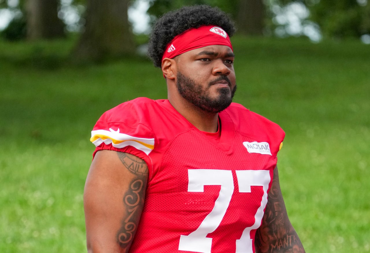 Jul 22, 2025; St. Joseph, MO, USA; Kansas City Chiefs guard Jaylon Moore (77) walks down the hill to the practice fields during training camp at Missouri Western State University. Mandatory Credit: Denny Medley-Imagn Images